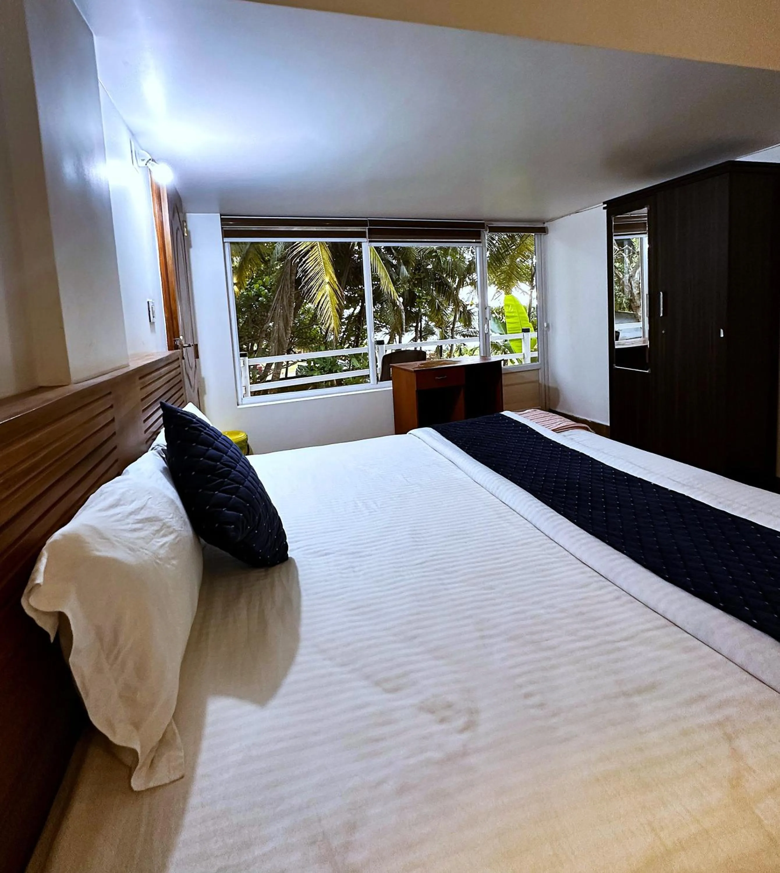 Bed in White Shell Beach House