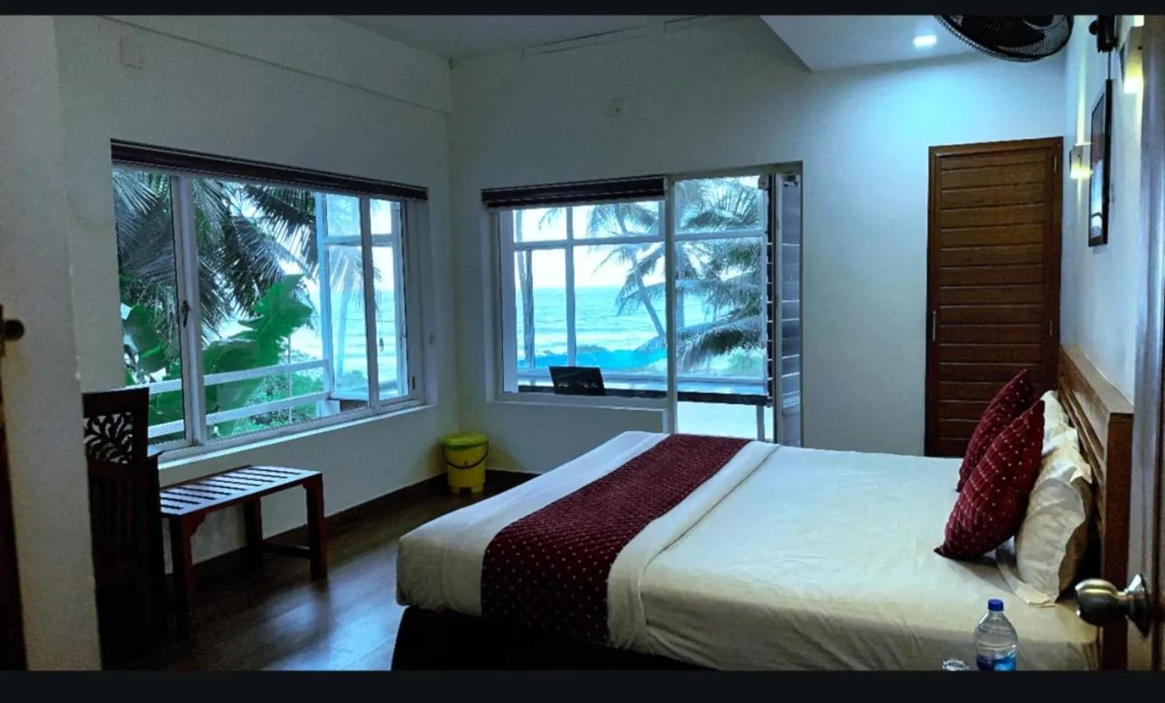 Bed in White Shell Beach House