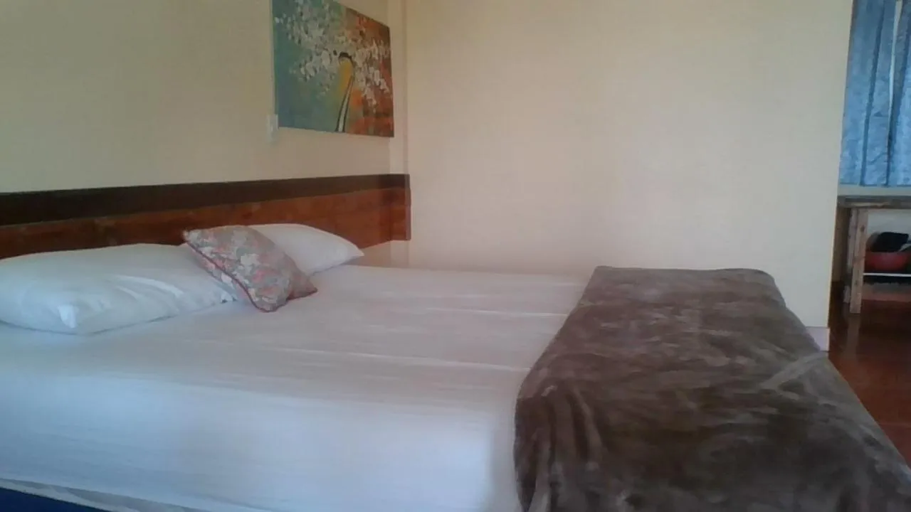 Bed in Tropicana Khophagan Resort Hotel