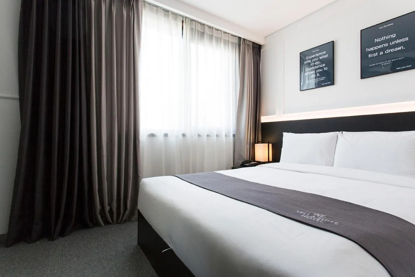 Bed in Vella Suite Hotel