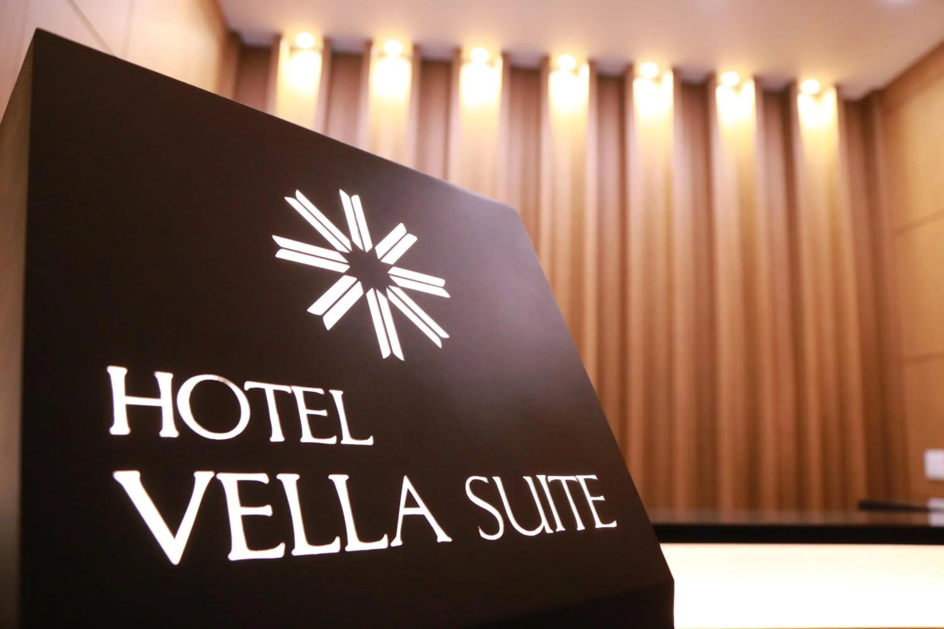 Property logo or sign in Vella Suite Hotel