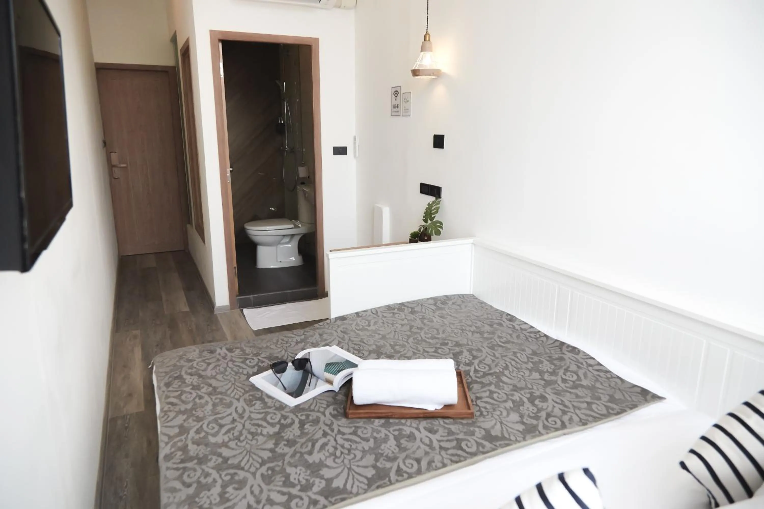 Bed in Vann Bangkok Boutique House