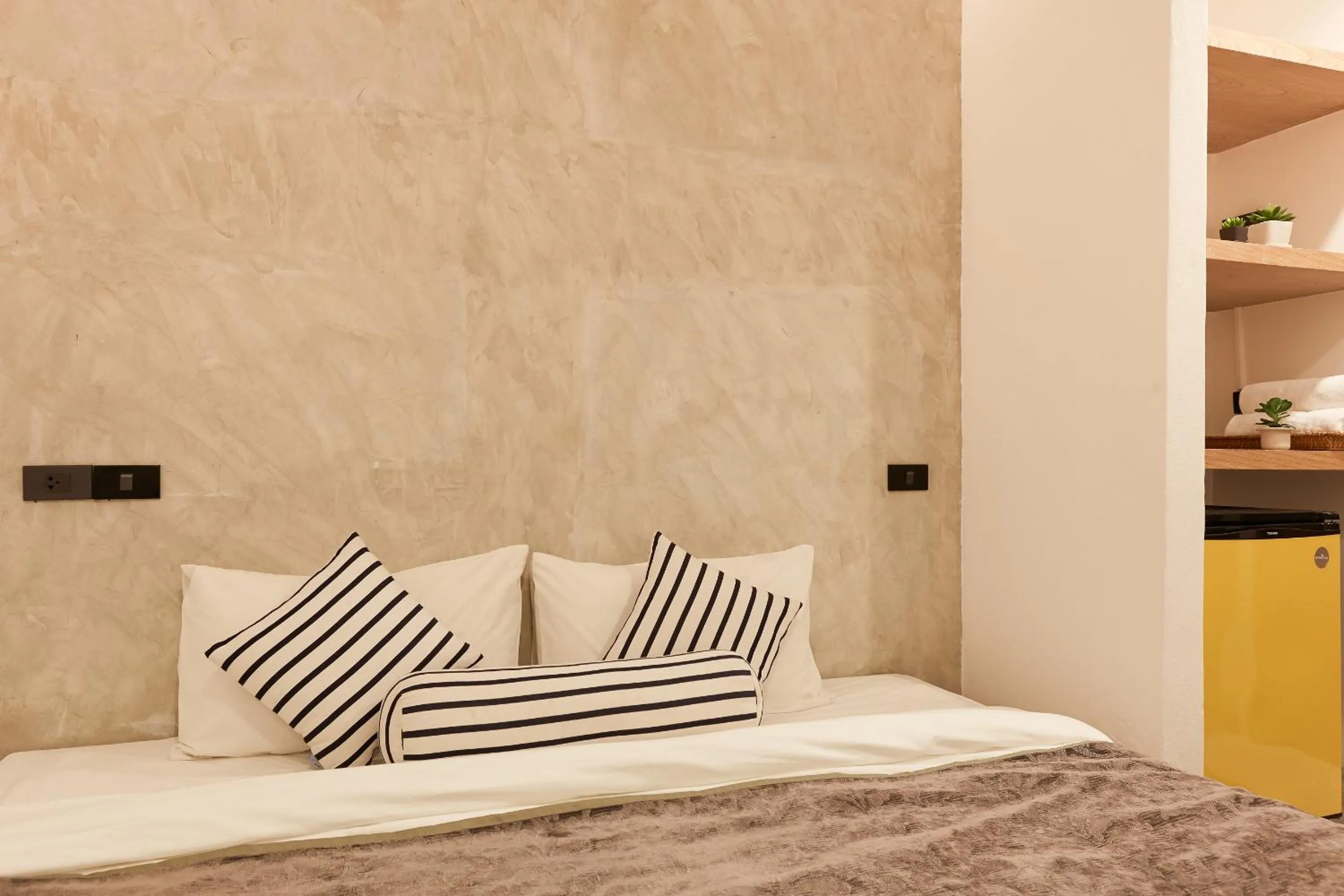 Bed in Vann Bangkok Boutique House