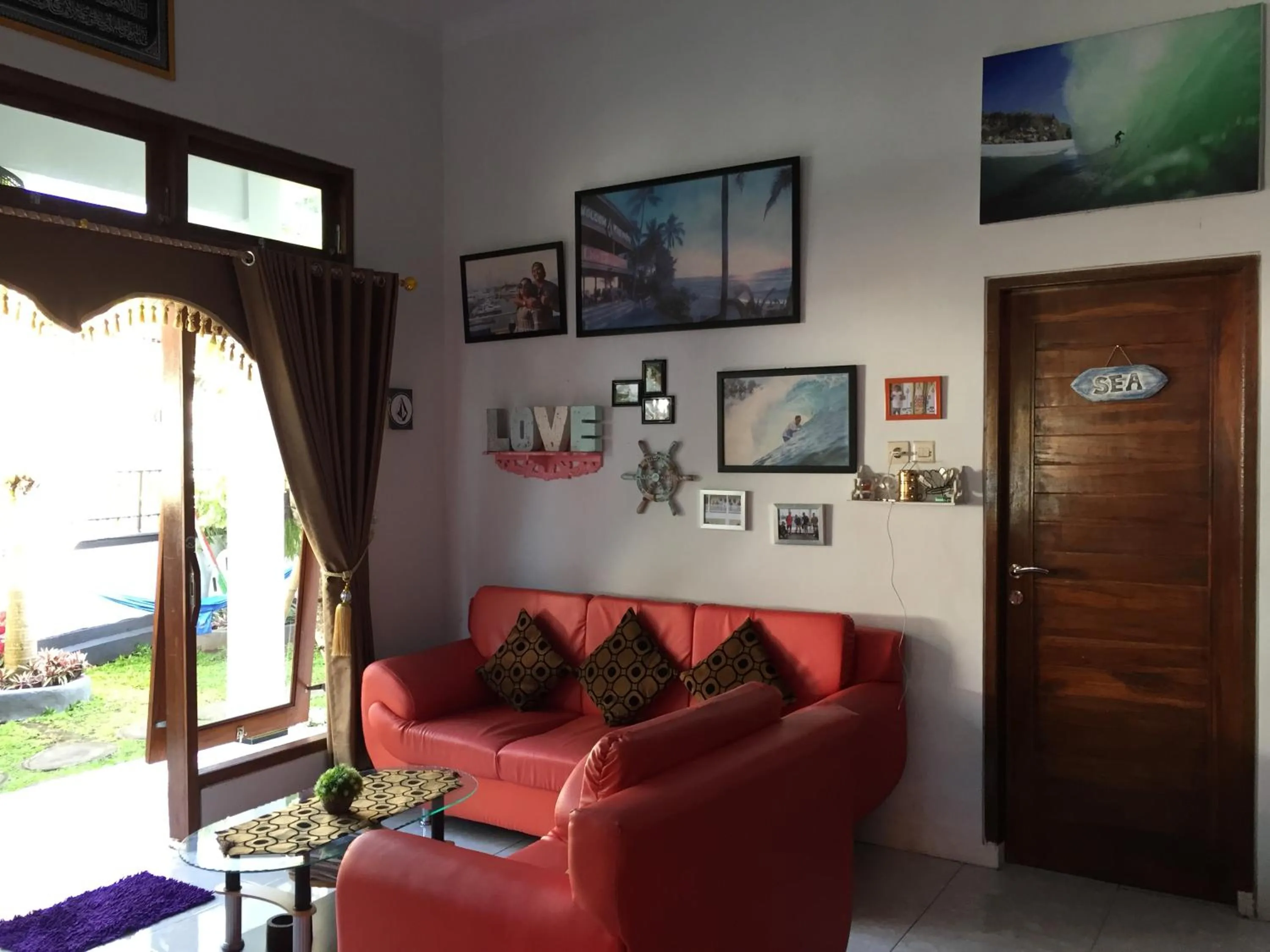 Communal lounge/ TV room in Medewi Secret SurfCamp