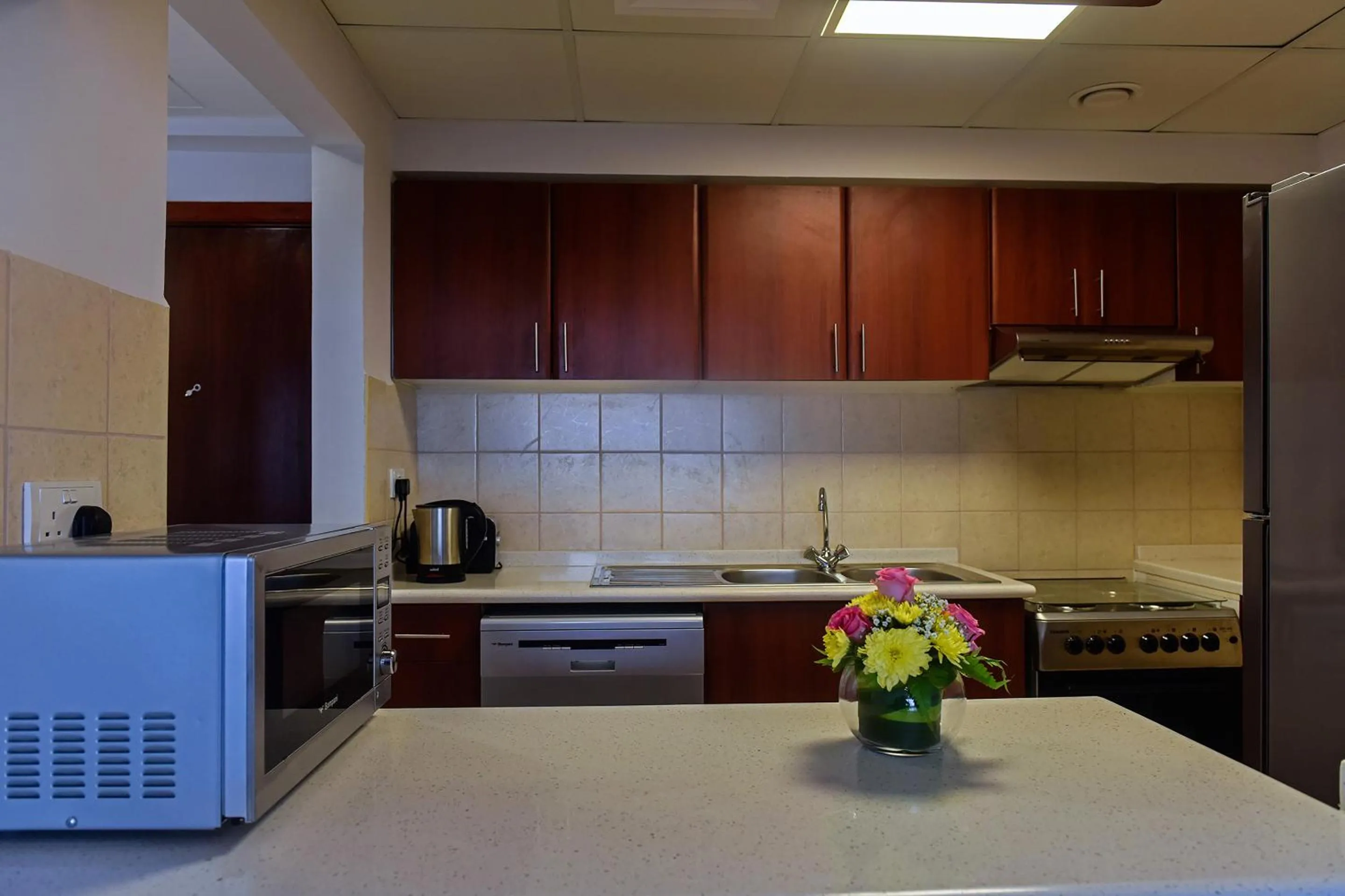 Kitchen or kitchenette in Jannah Hotel Apartments & Villas