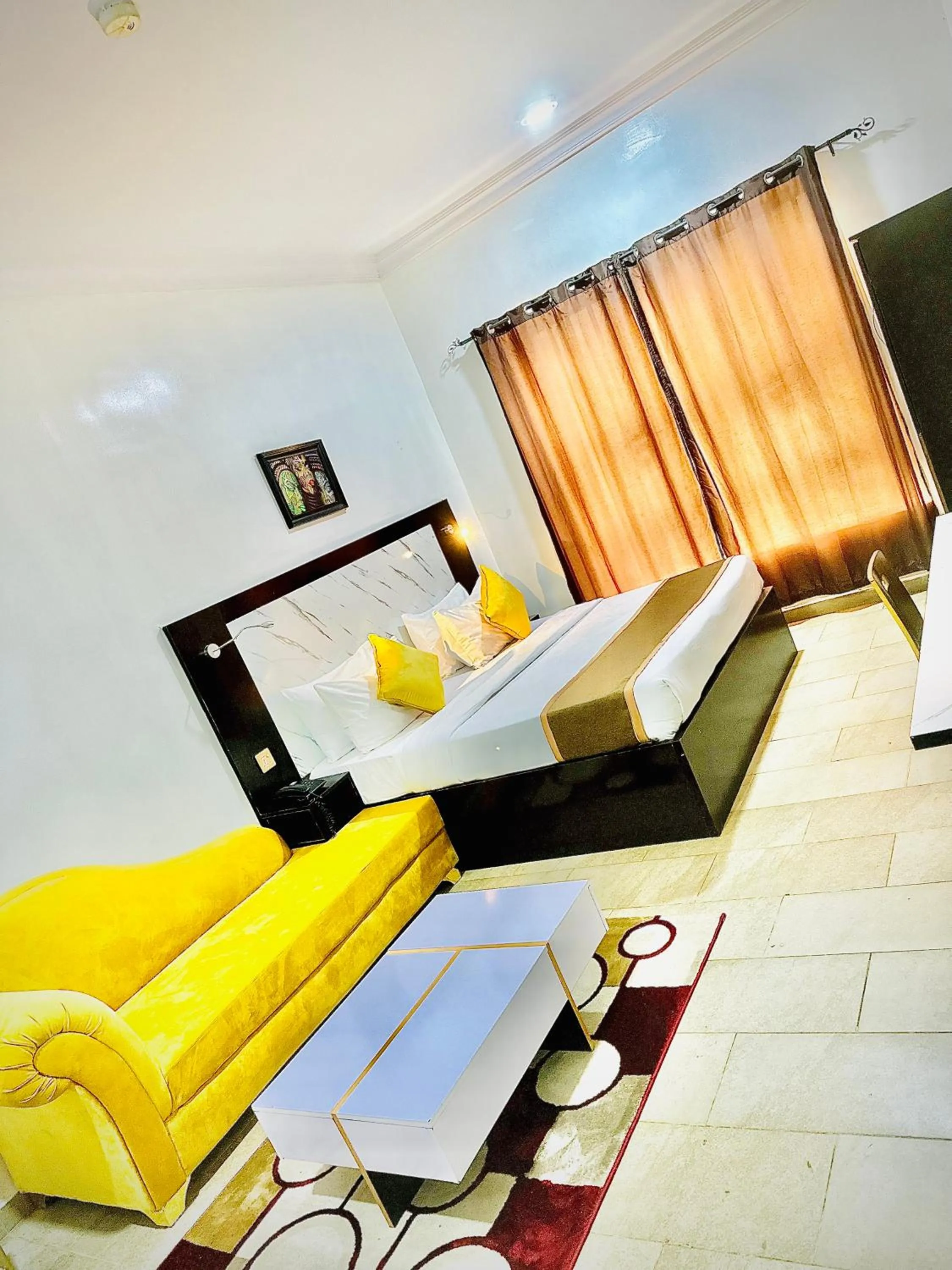 Seating area, Bed in Posh Hotel and Suites Ikeja