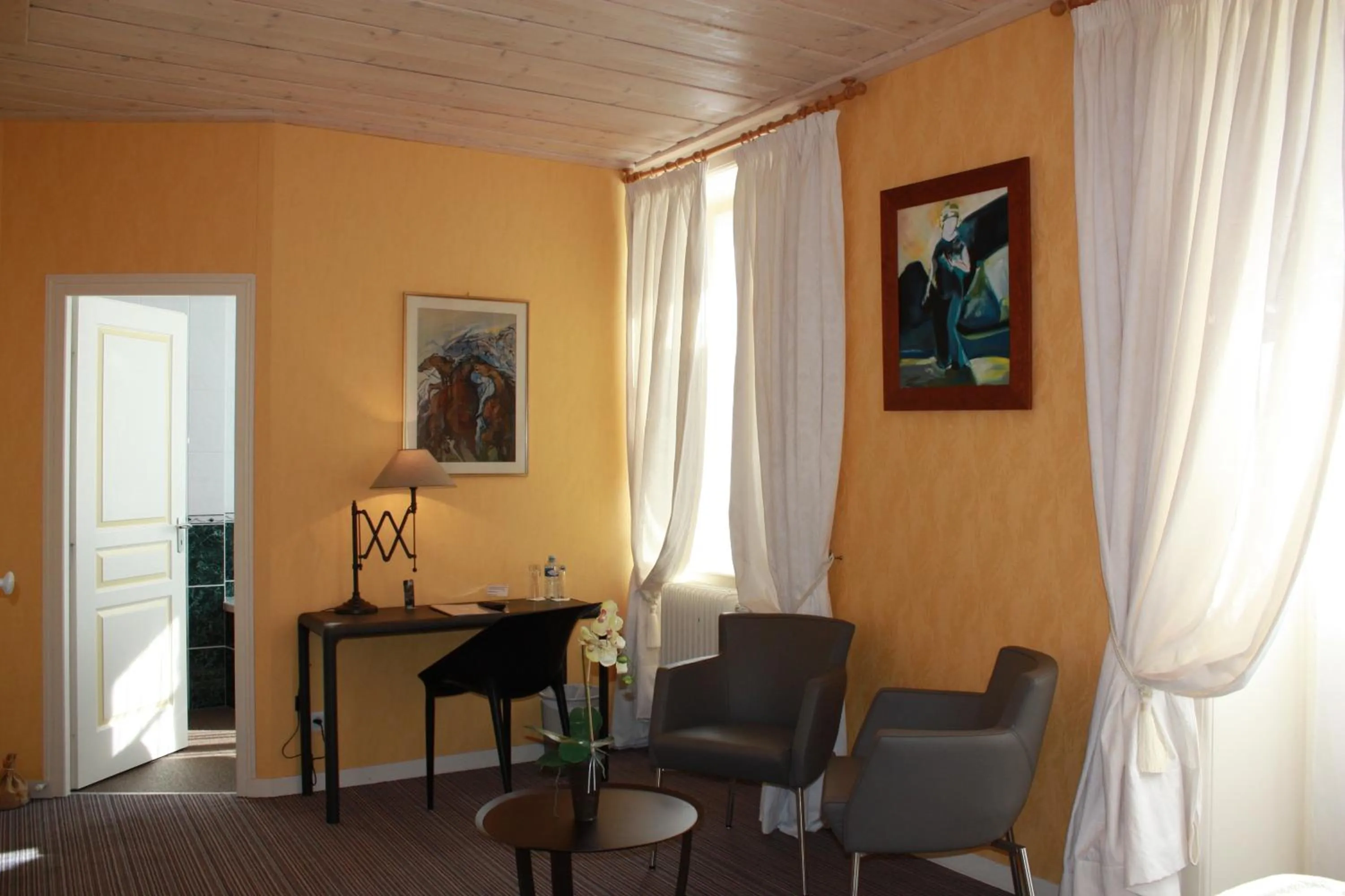 Seating area in Hôtel Restaurant Taillard