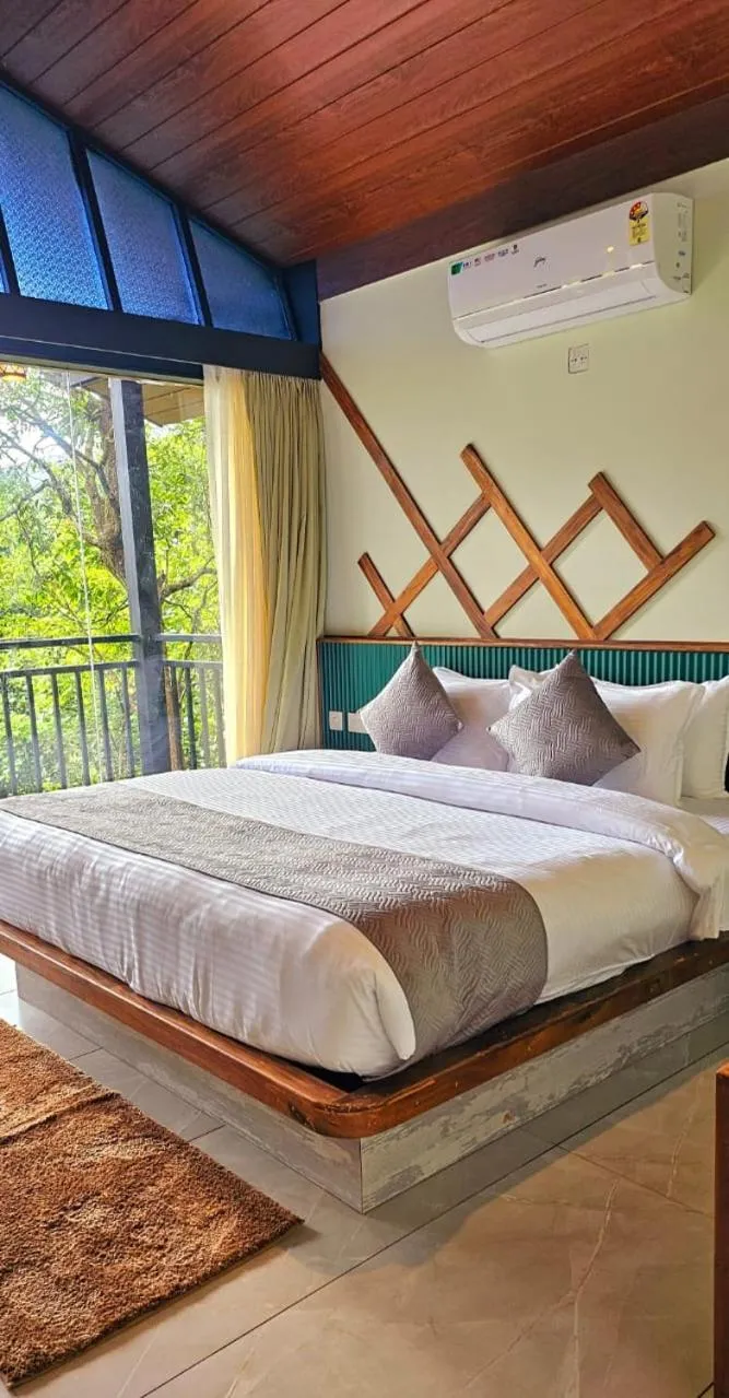 Bed in Vythiri Holiday Resort, Wayanad