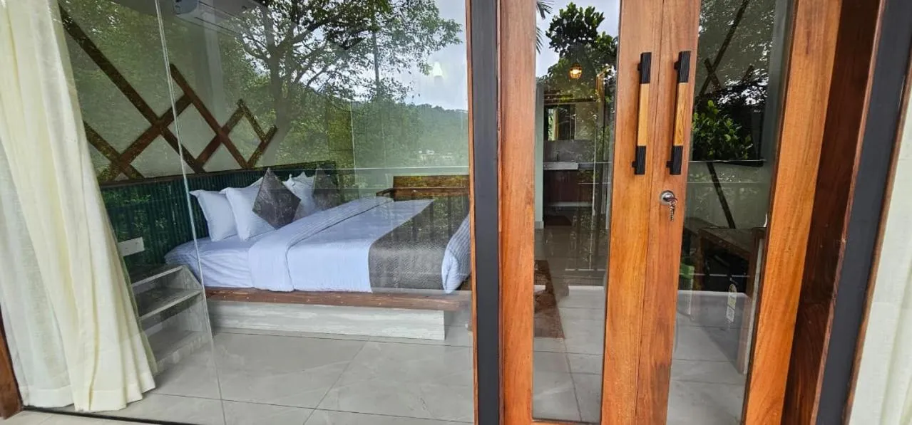 Bed in Vythiri Holiday Resort, Wayanad