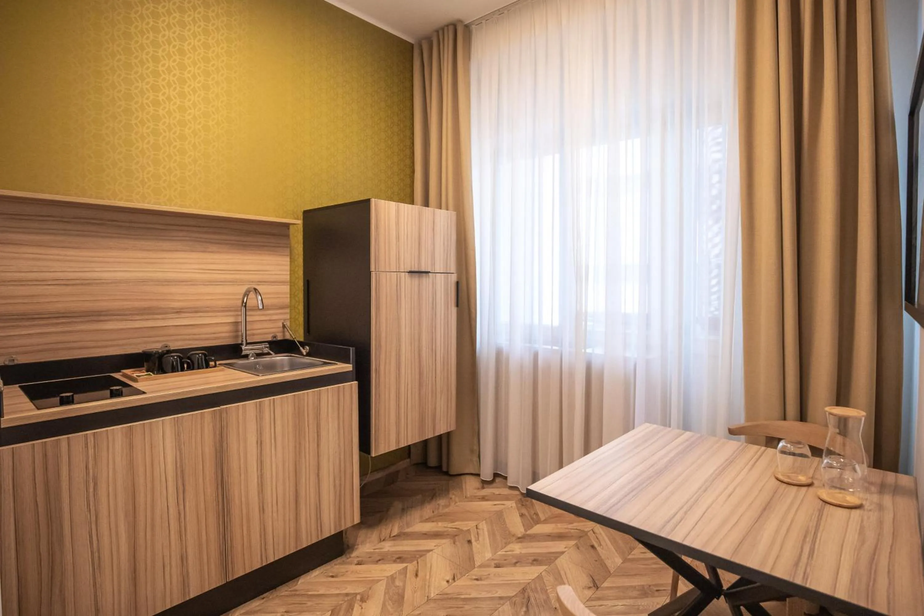 Kitchen or kitchenette in Urban Boutique Hotel Center