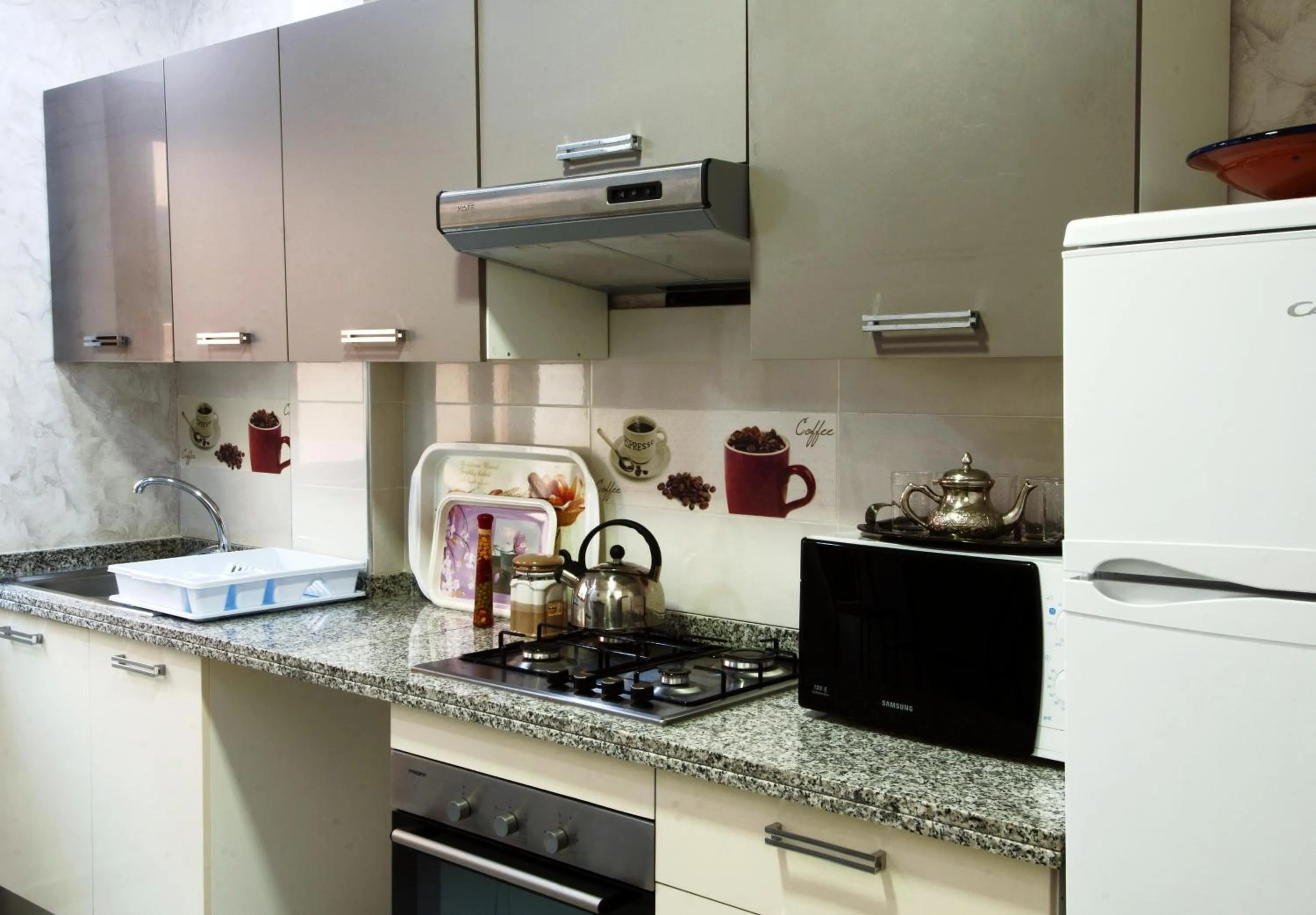 Kitchen or kitchenette in Aparthotel Les Oliviers Suites & Spa