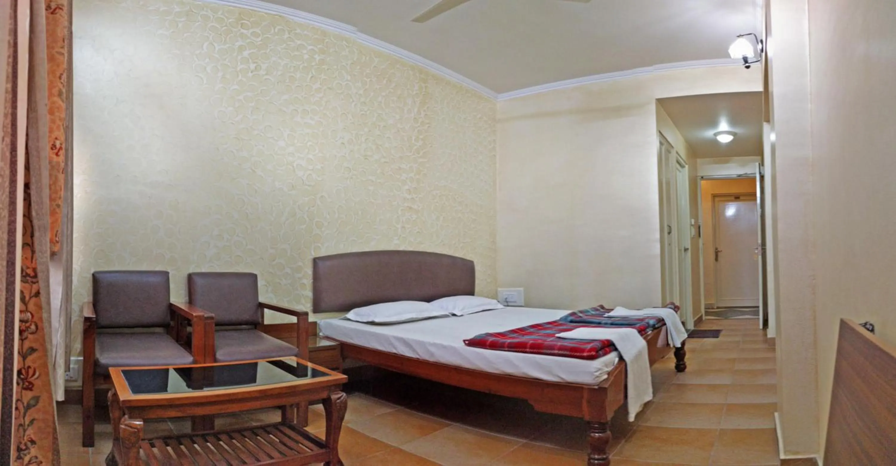 Bed in Hotel Rangoli