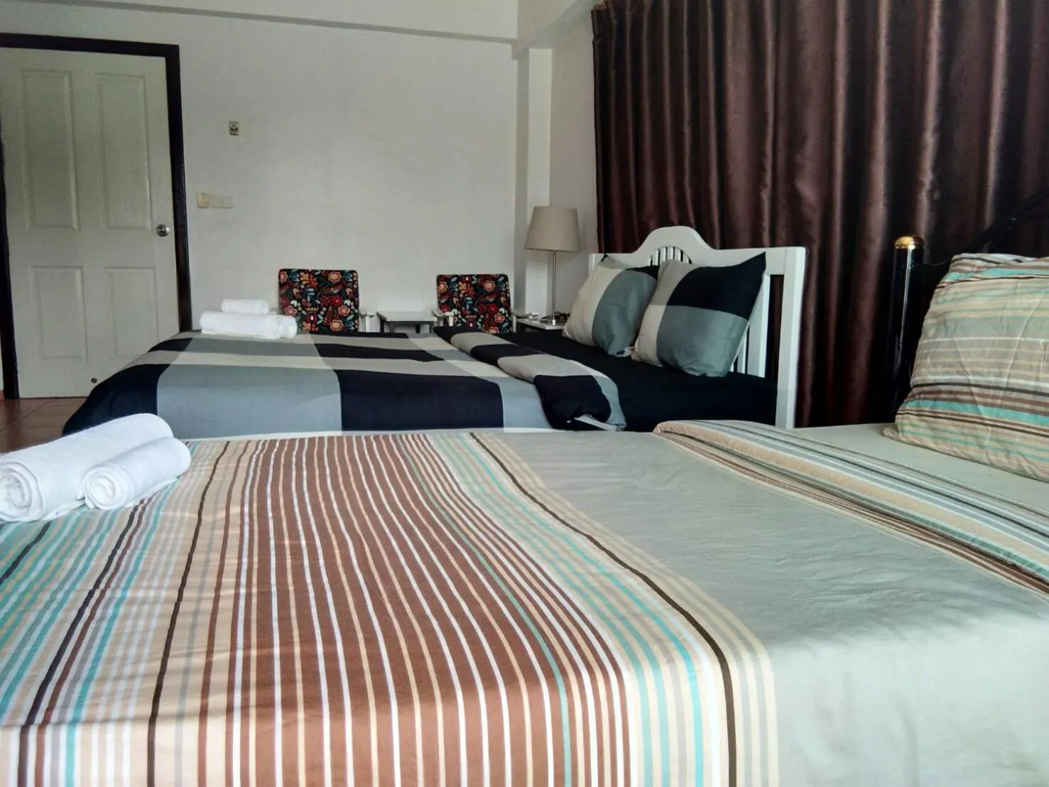 Bed in Lomsabai Apartments