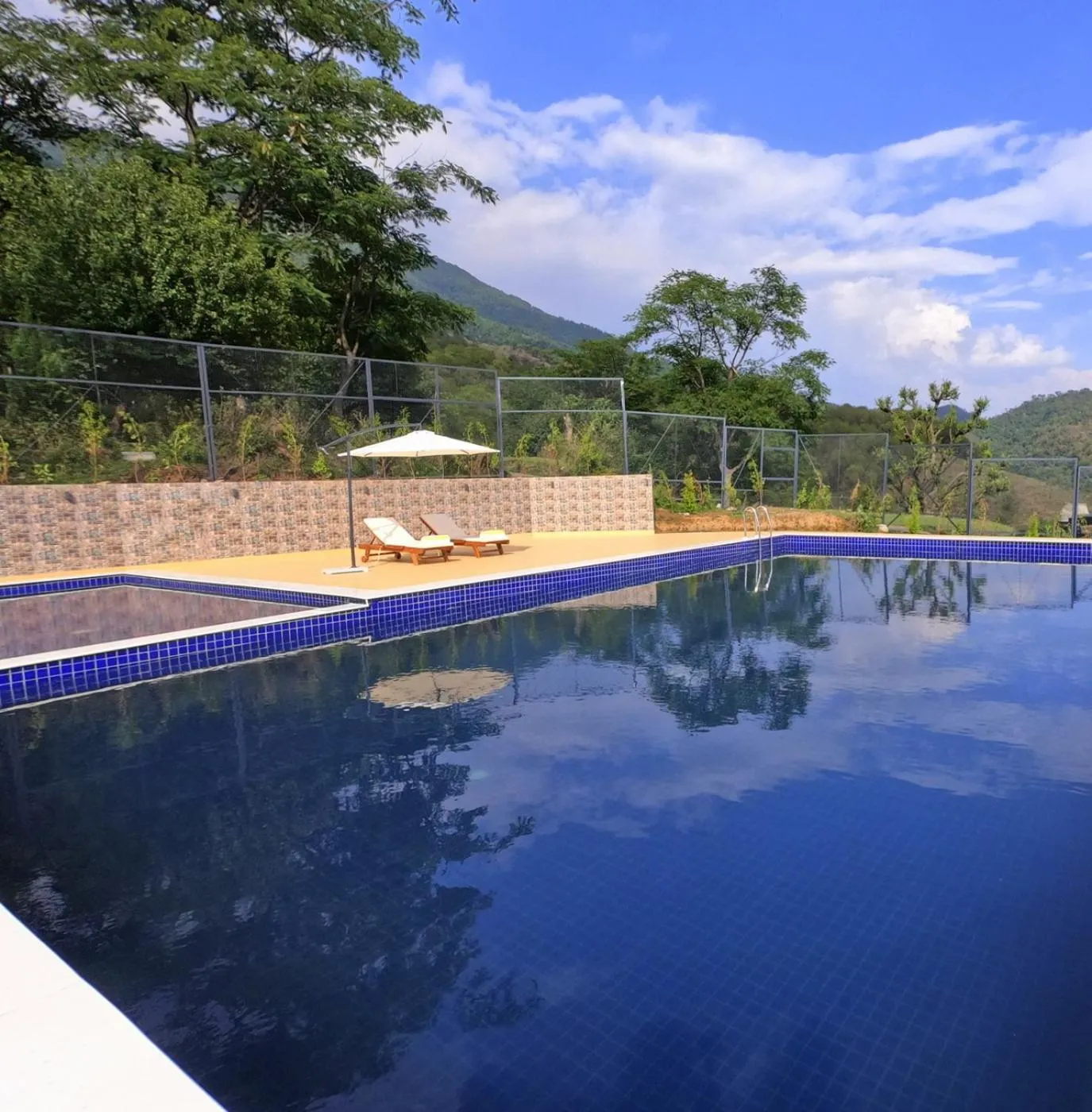 Swimming pool in Rakkh Resort, a member of Radisson Individuals Retreats