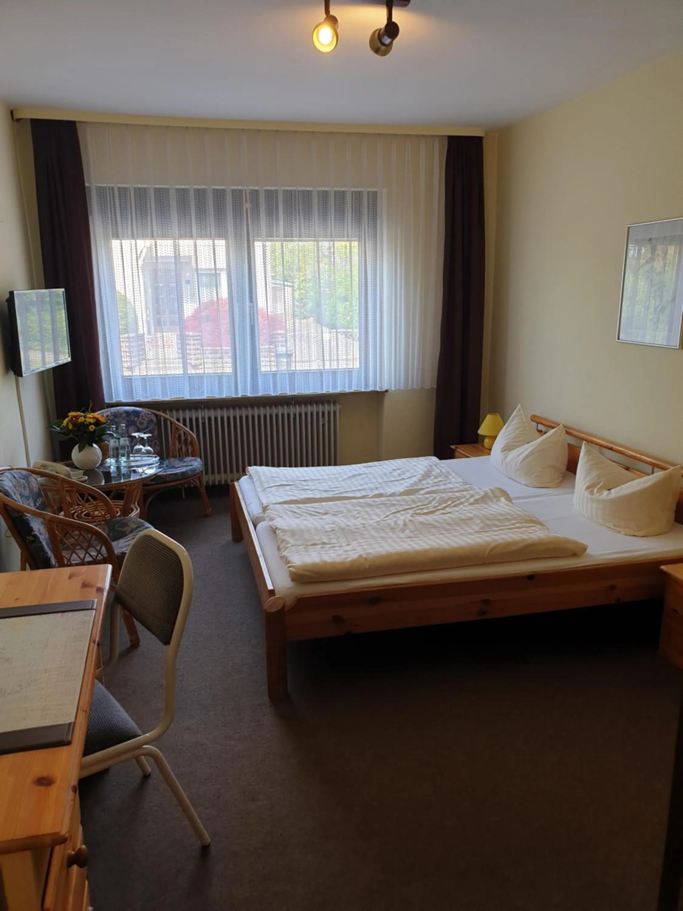 Photo of the whole room, Bed in Heidehotel Anna