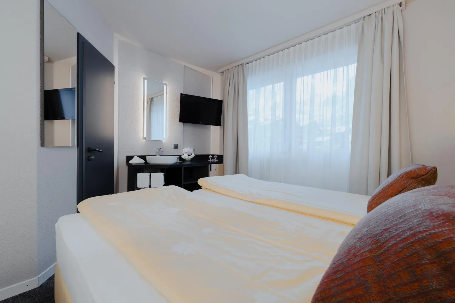 Bed in Hotel Central Wolter - Grindelwald