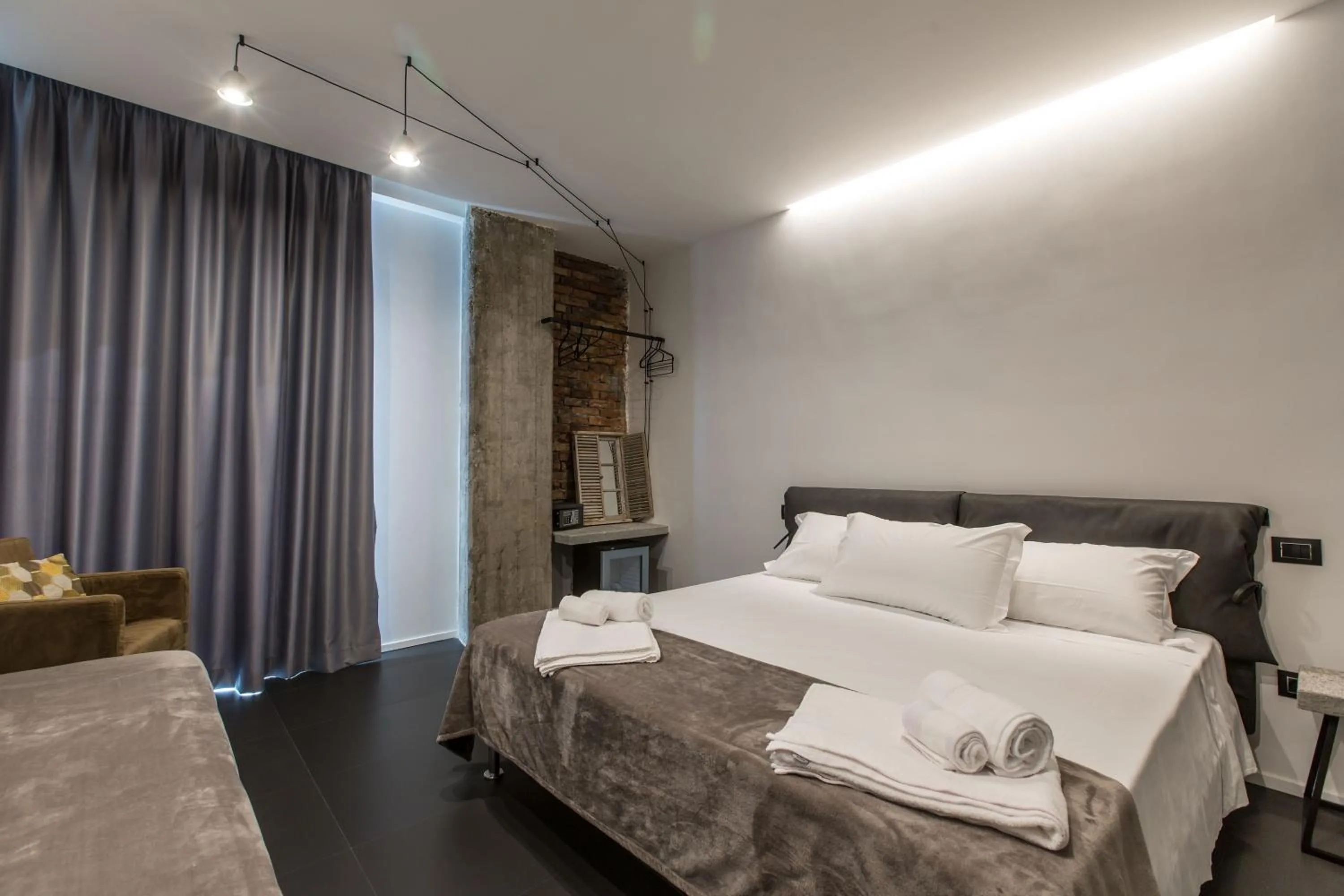 Bed in The Boutique Napoli Suite