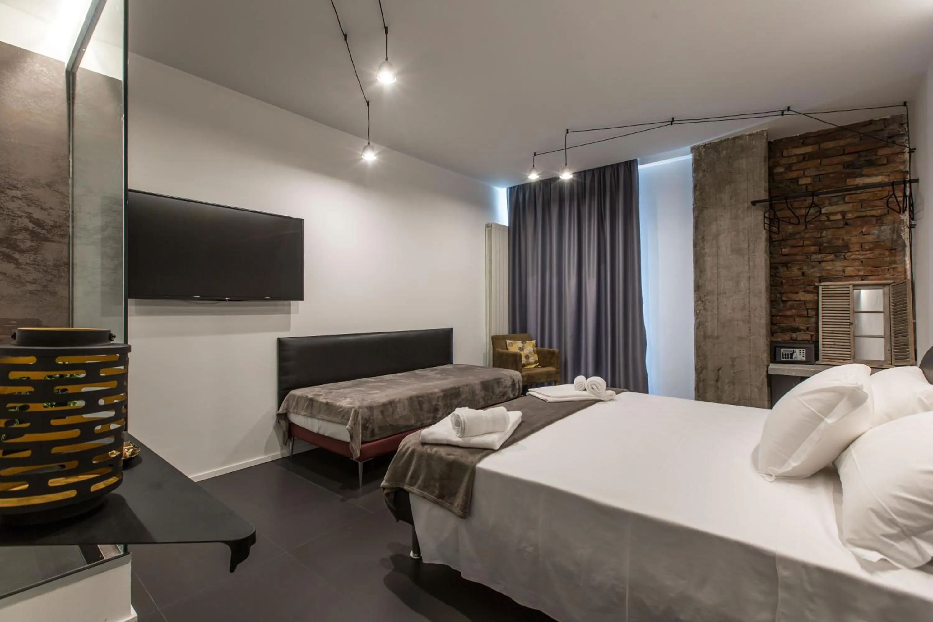 Bed in The Boutique Napoli Suite