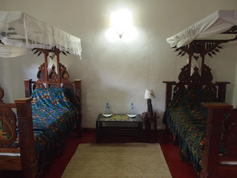 Bedroom in The Old Boma Hotel