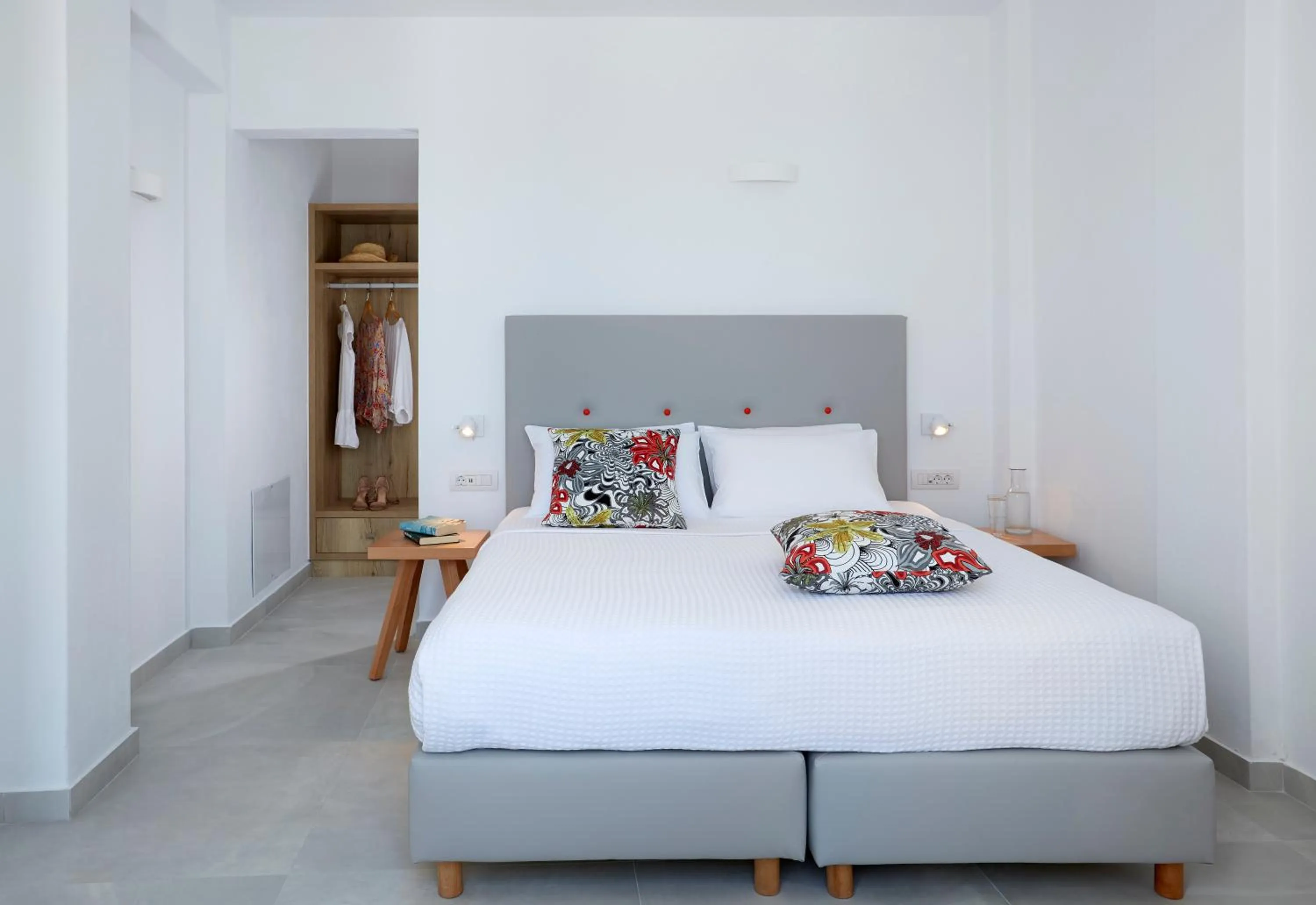 Bed in Aperanto Suites