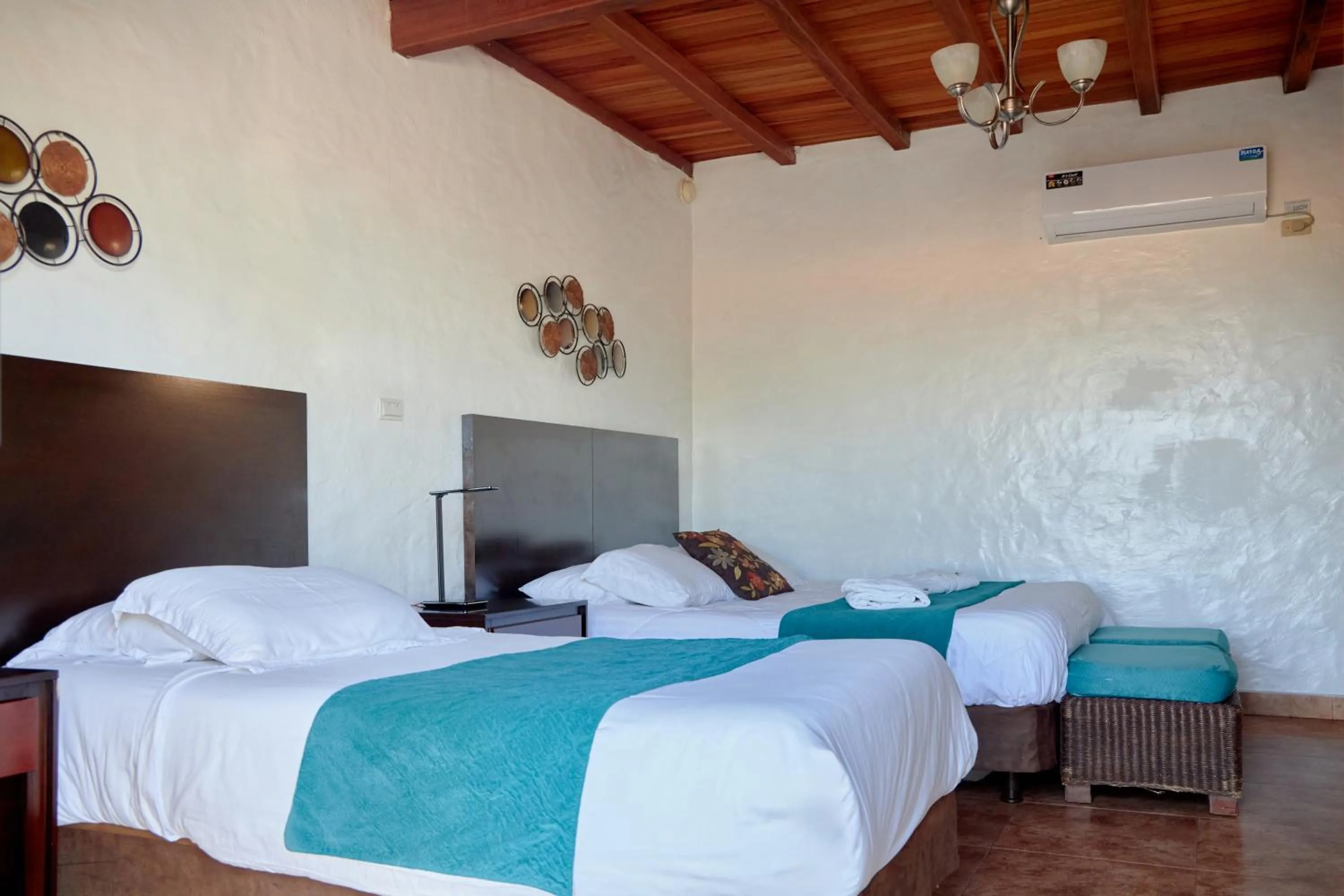 Bed in Hotel Isamar Galapagos Beachfront