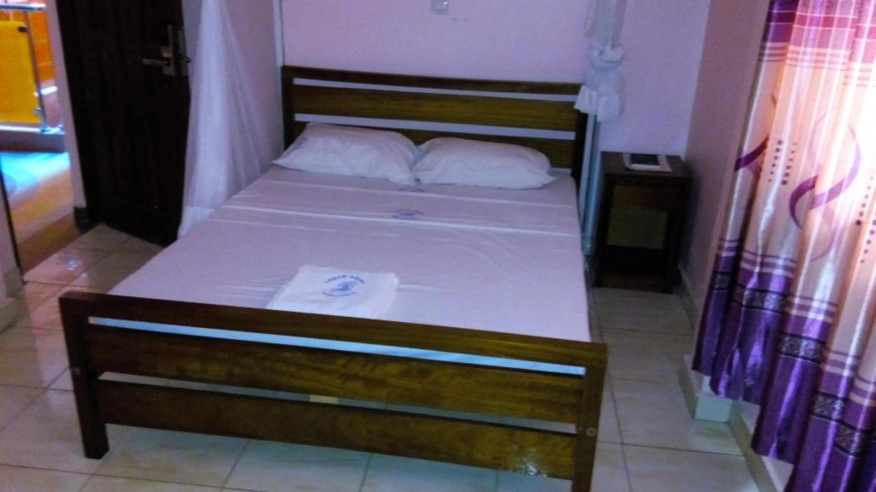 Bed in Checkpoint Inn Hotel, Mombasa