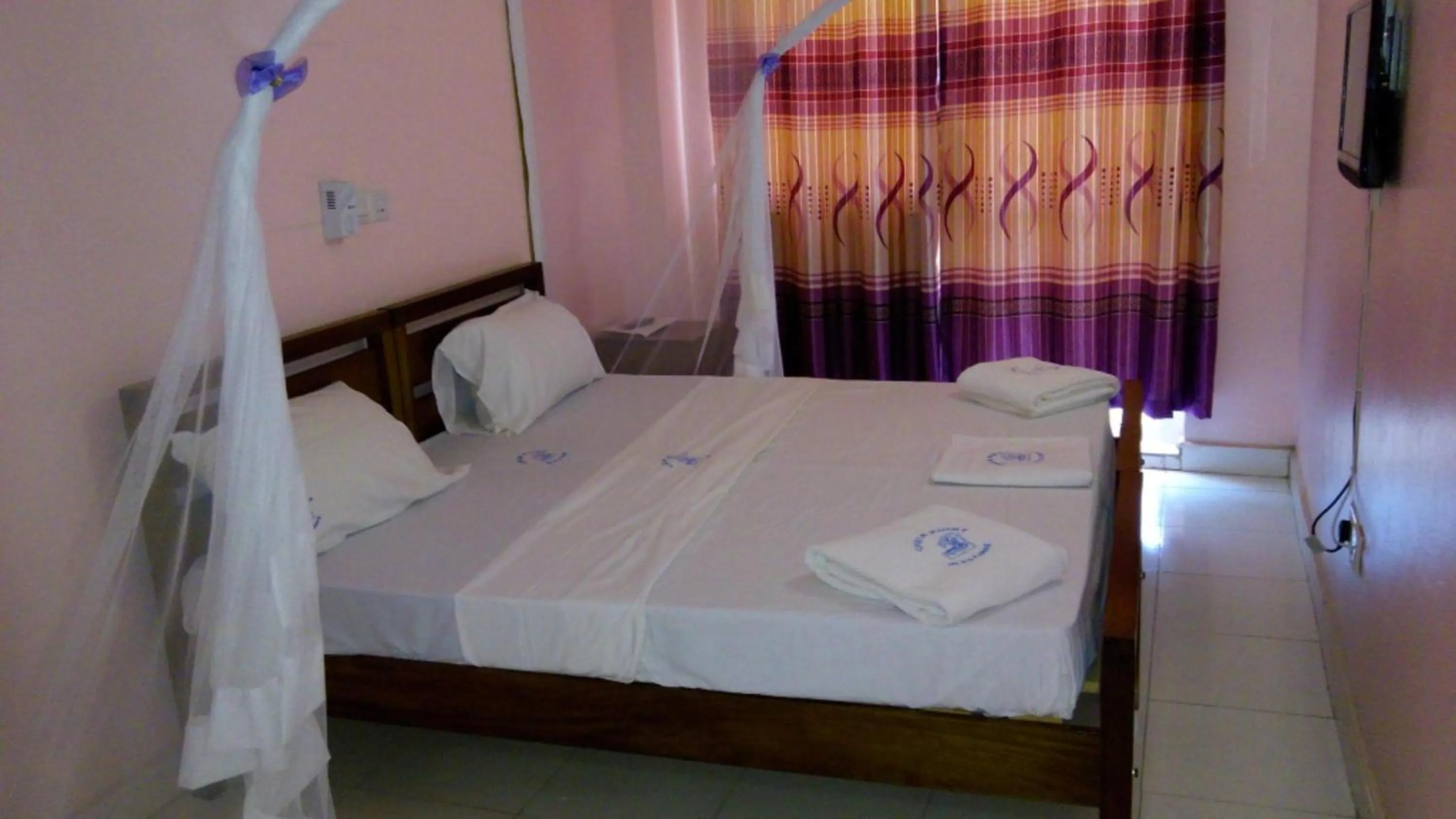 Bed in Checkpoint Inn Hotel, Mombasa