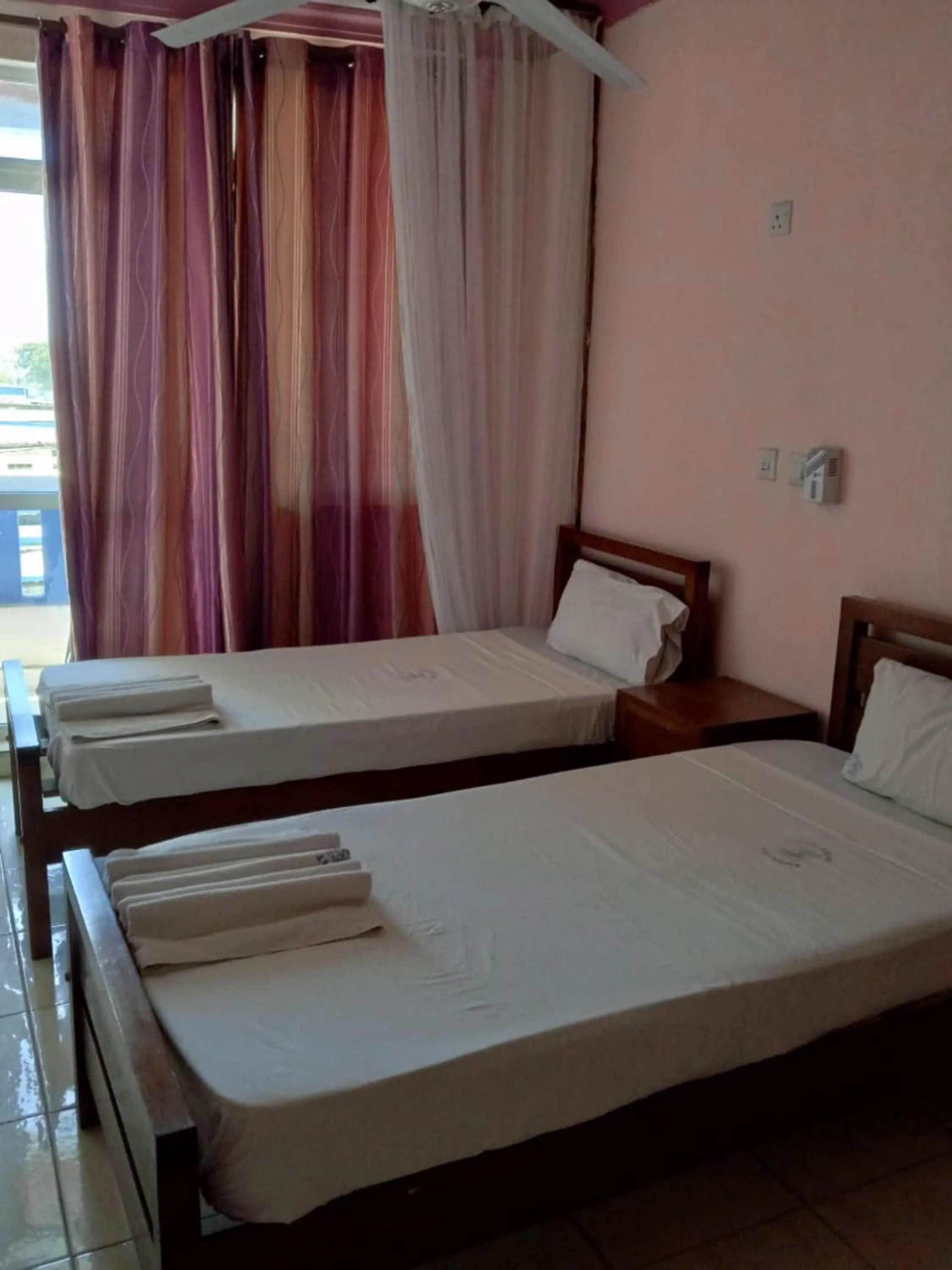 Bed in Checkpoint Inn Hotel, Mombasa