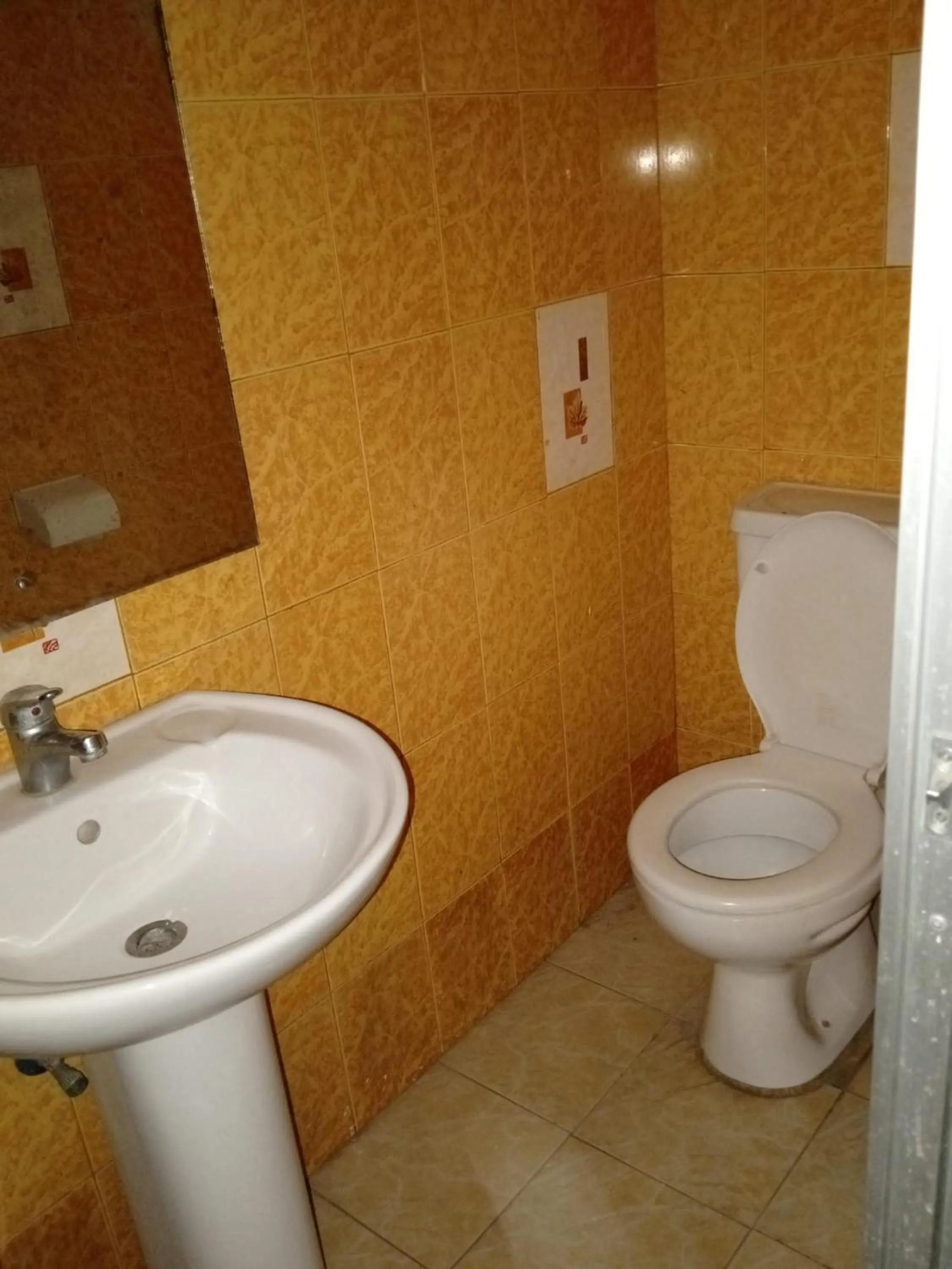 Toilet in Checkpoint Inn Hotel, Mombasa