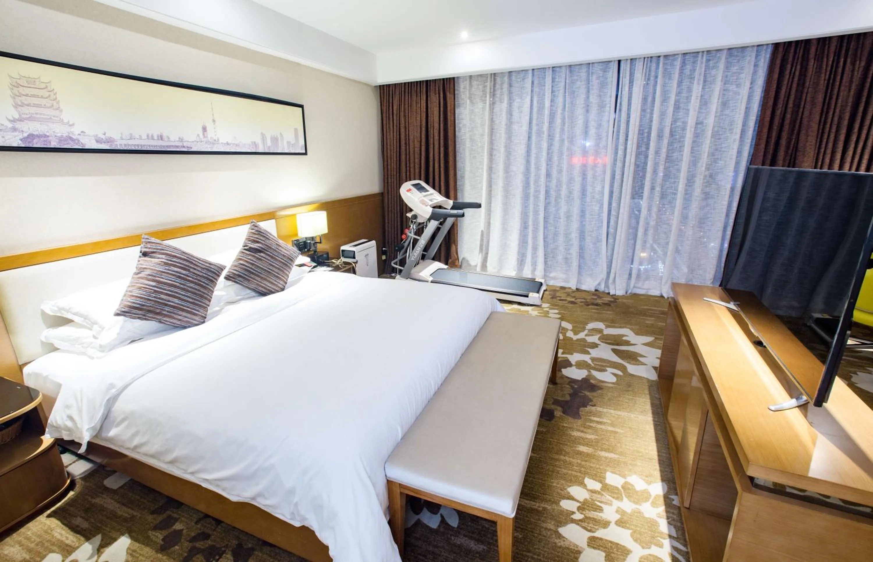 Bed in Ramada Encore Wuhan