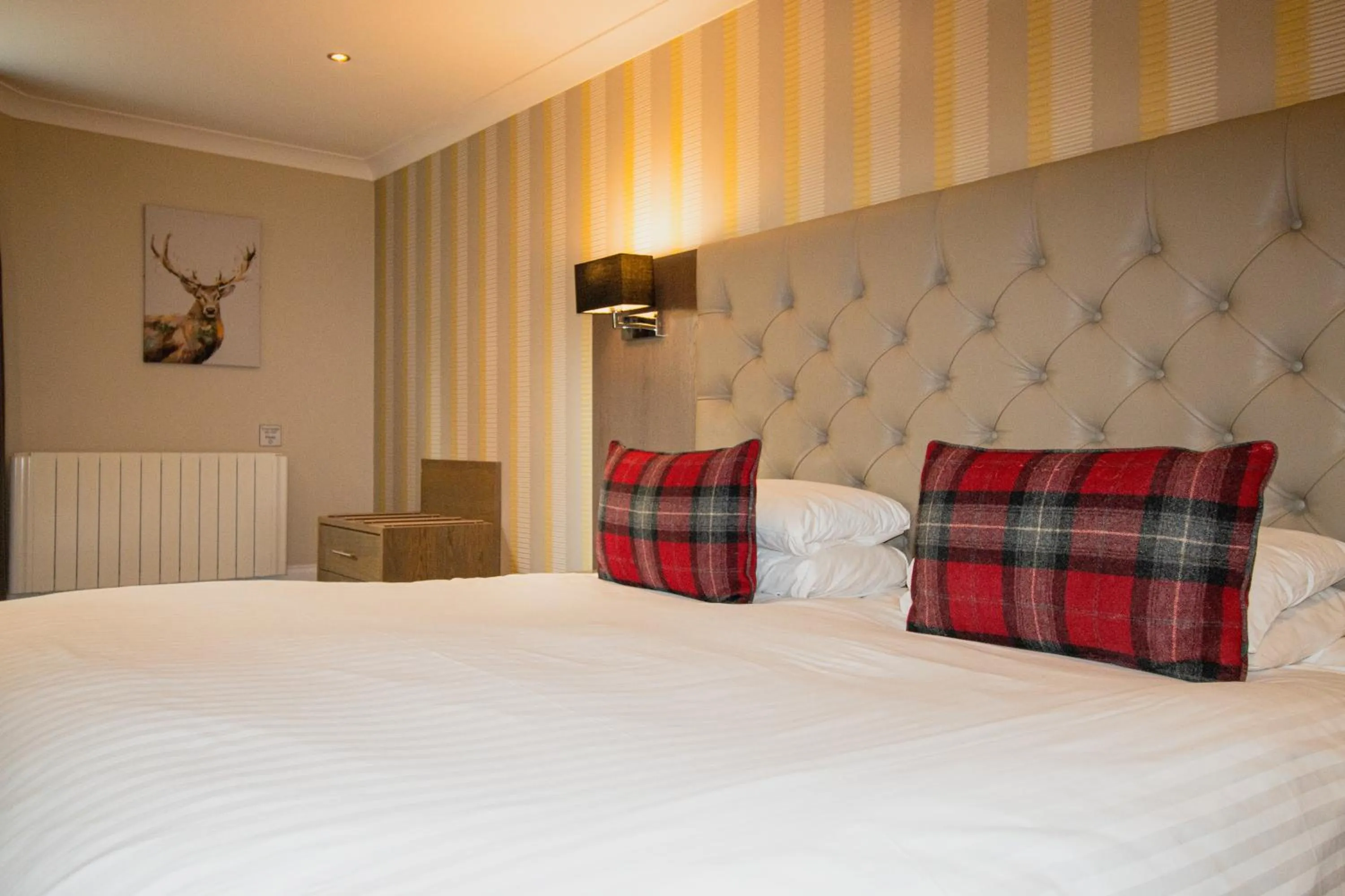 Bed in Ambassador Hotel