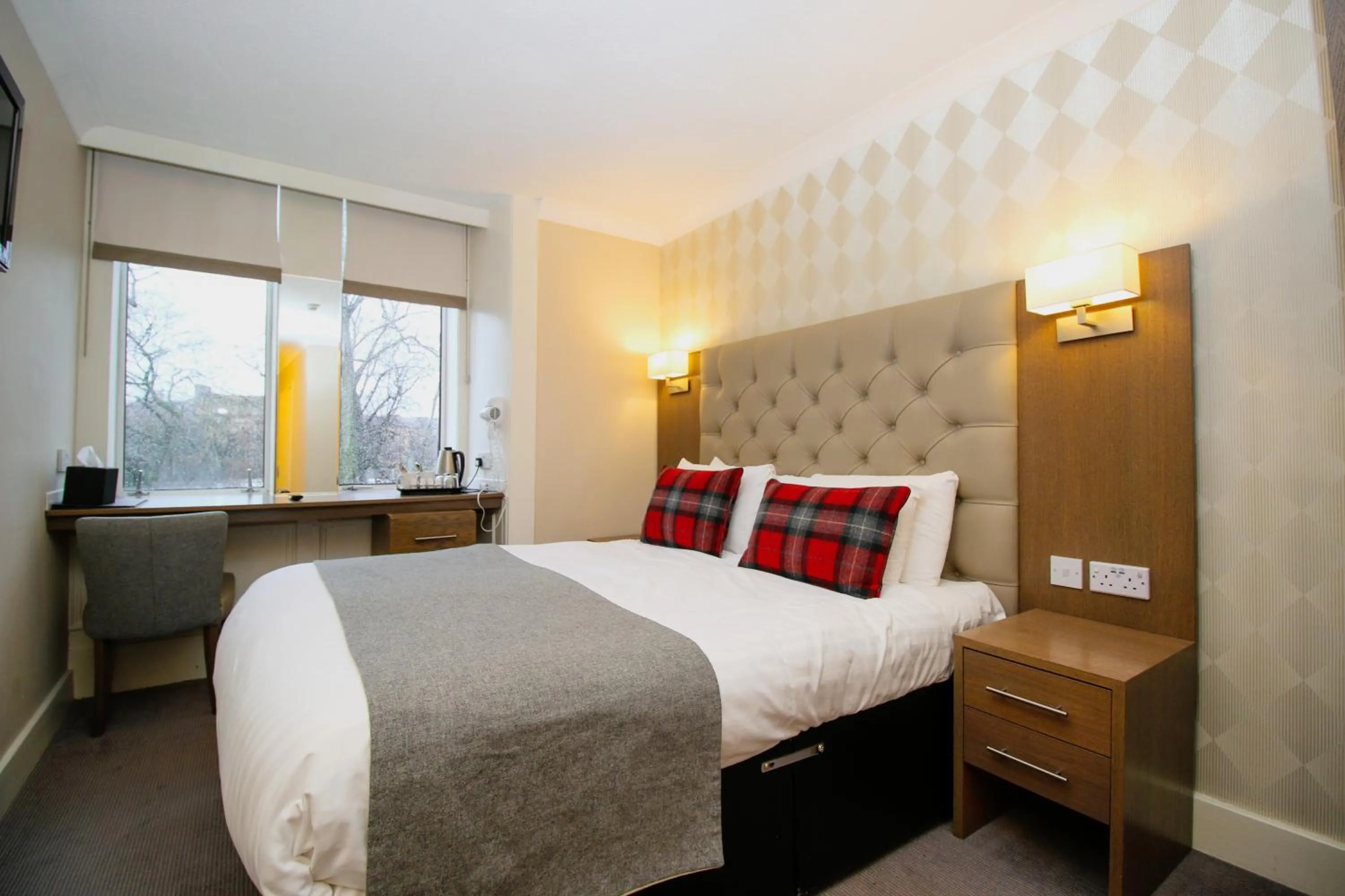 Bed in Ambassador Hotel