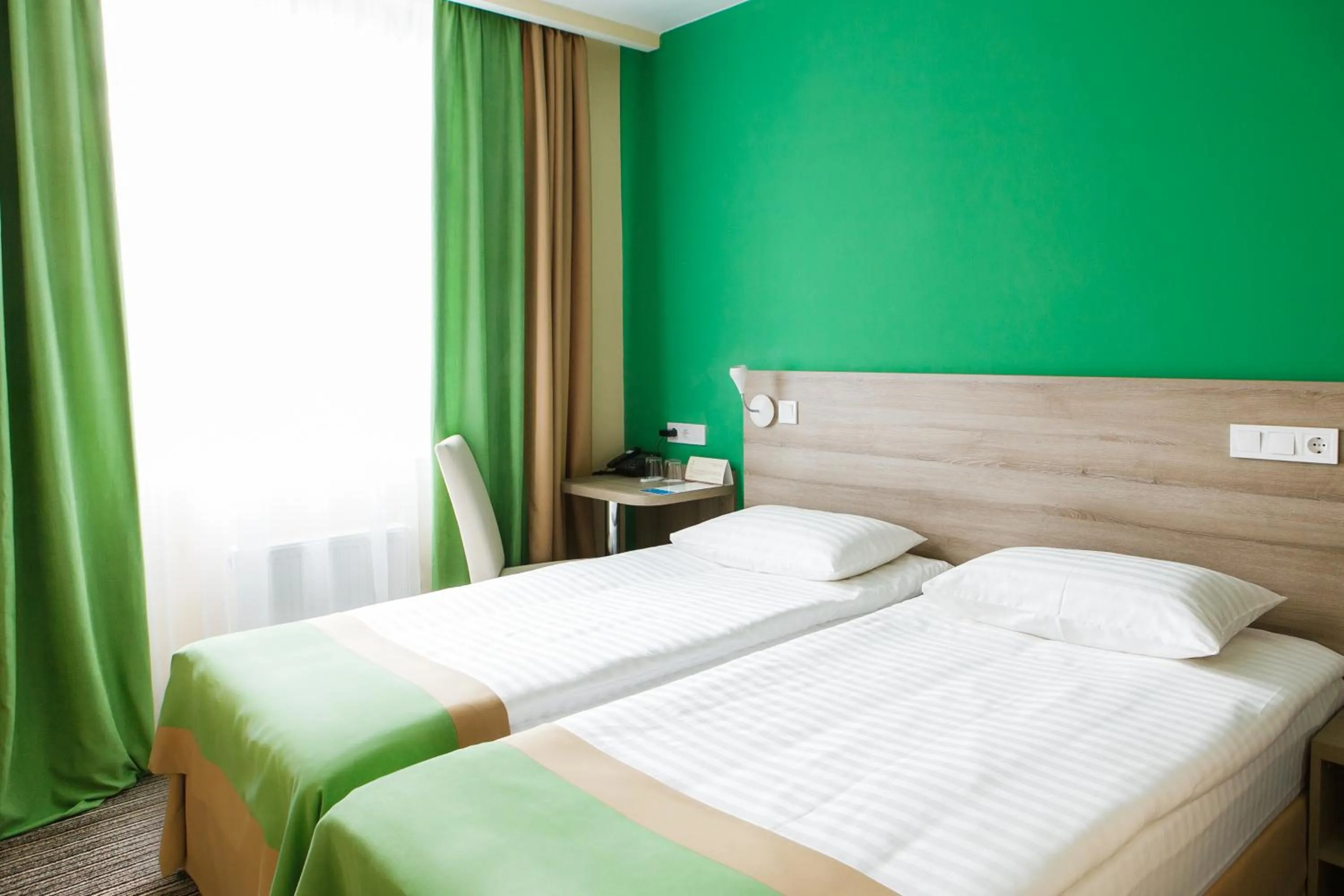 Bed in Raziotel Kyiv Yamska