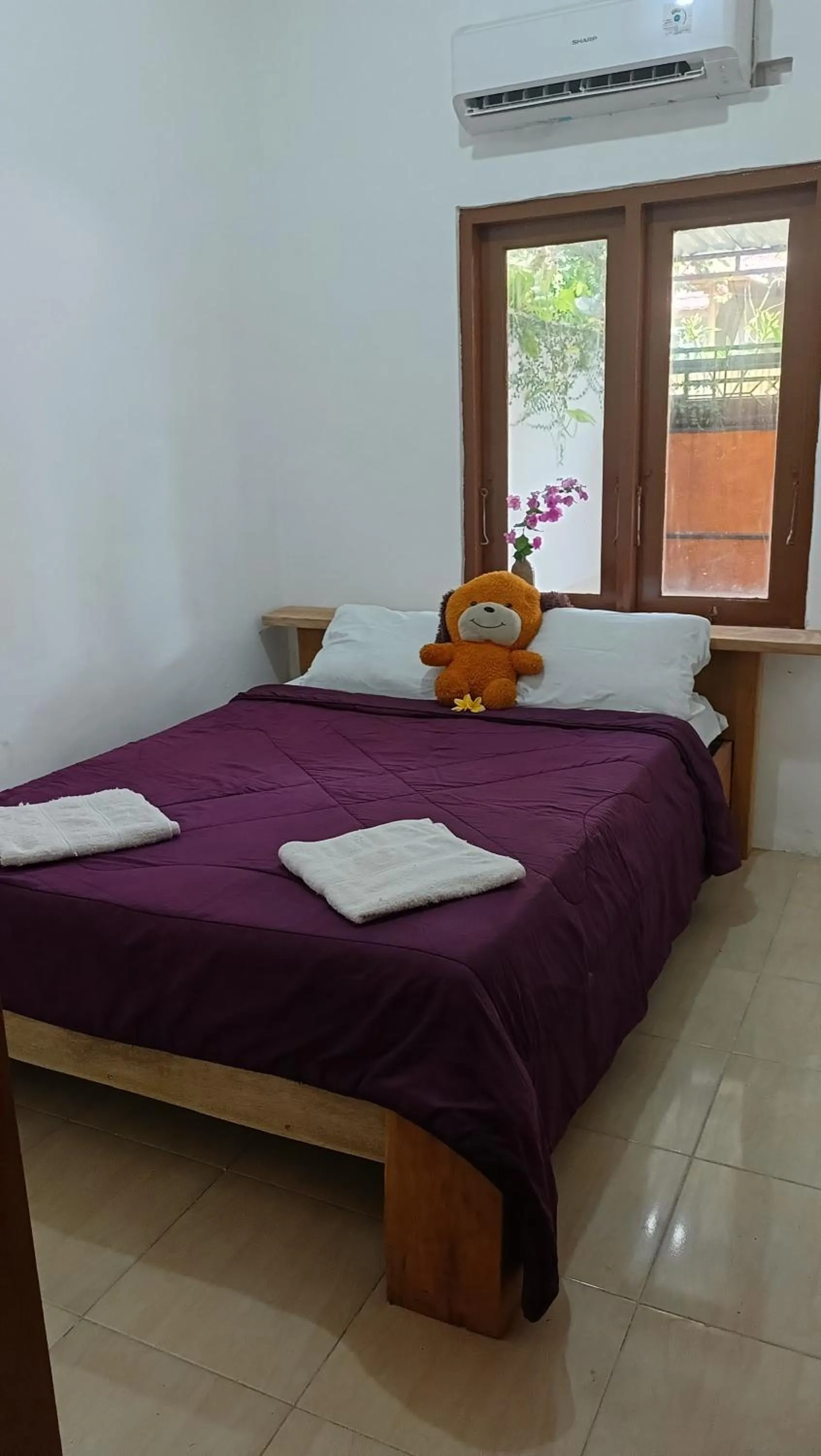 Bed in Shibui Garden Bungalows and Restaurant