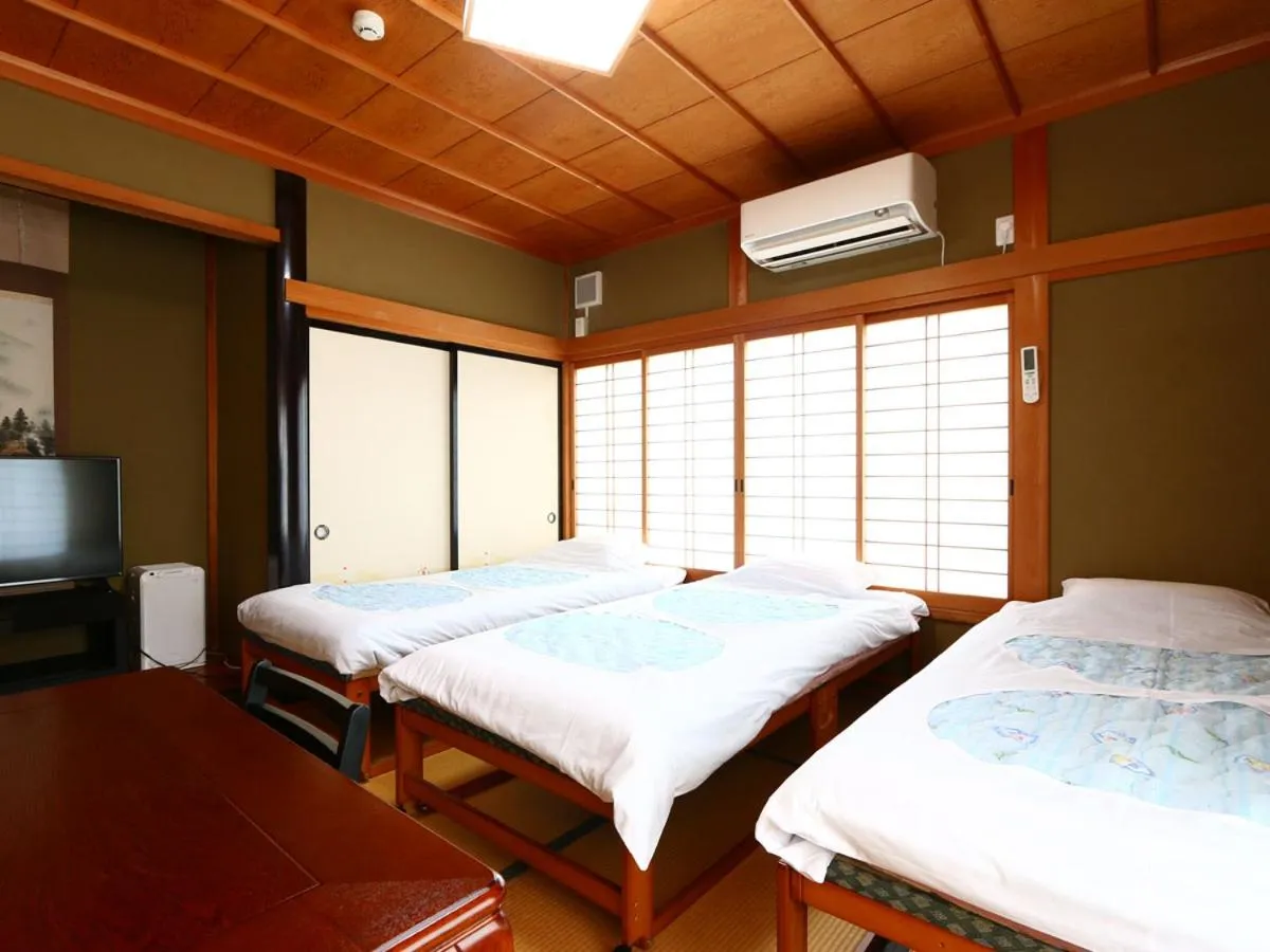 Bed in Minshuku Ryokan Kawai