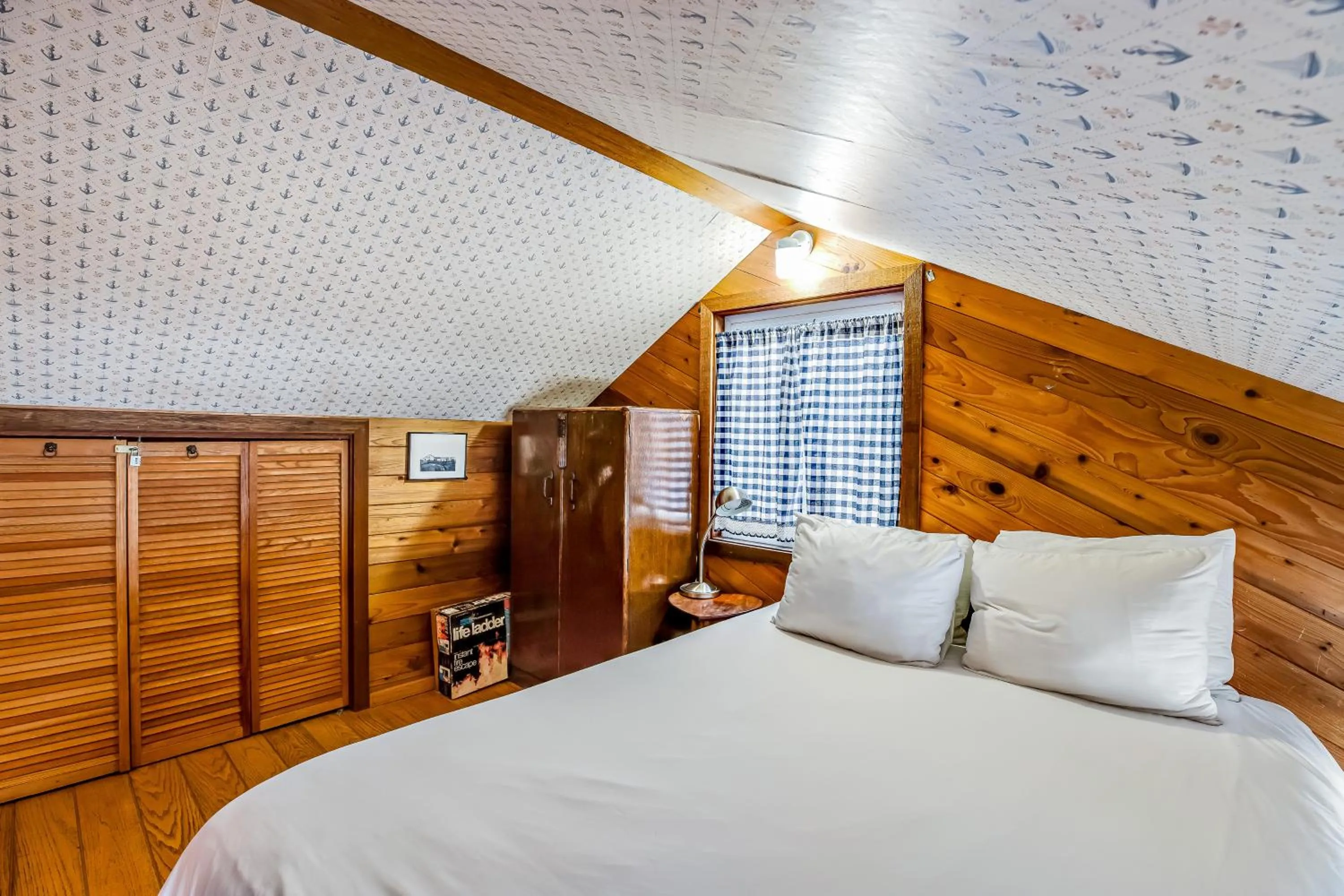 Bed in Blue Sea Oceanfront Cottage