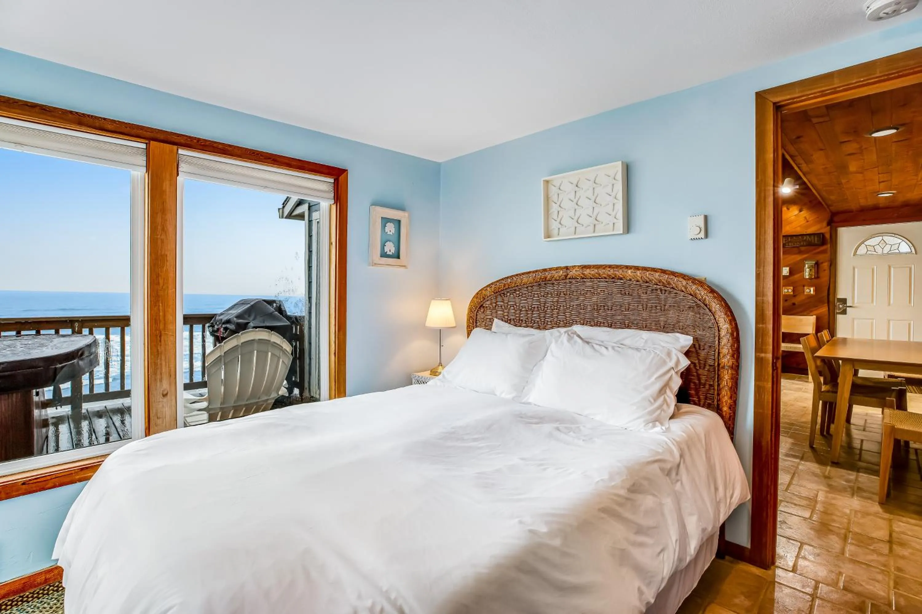 Bed in Blue Sea Oceanfront Cottage