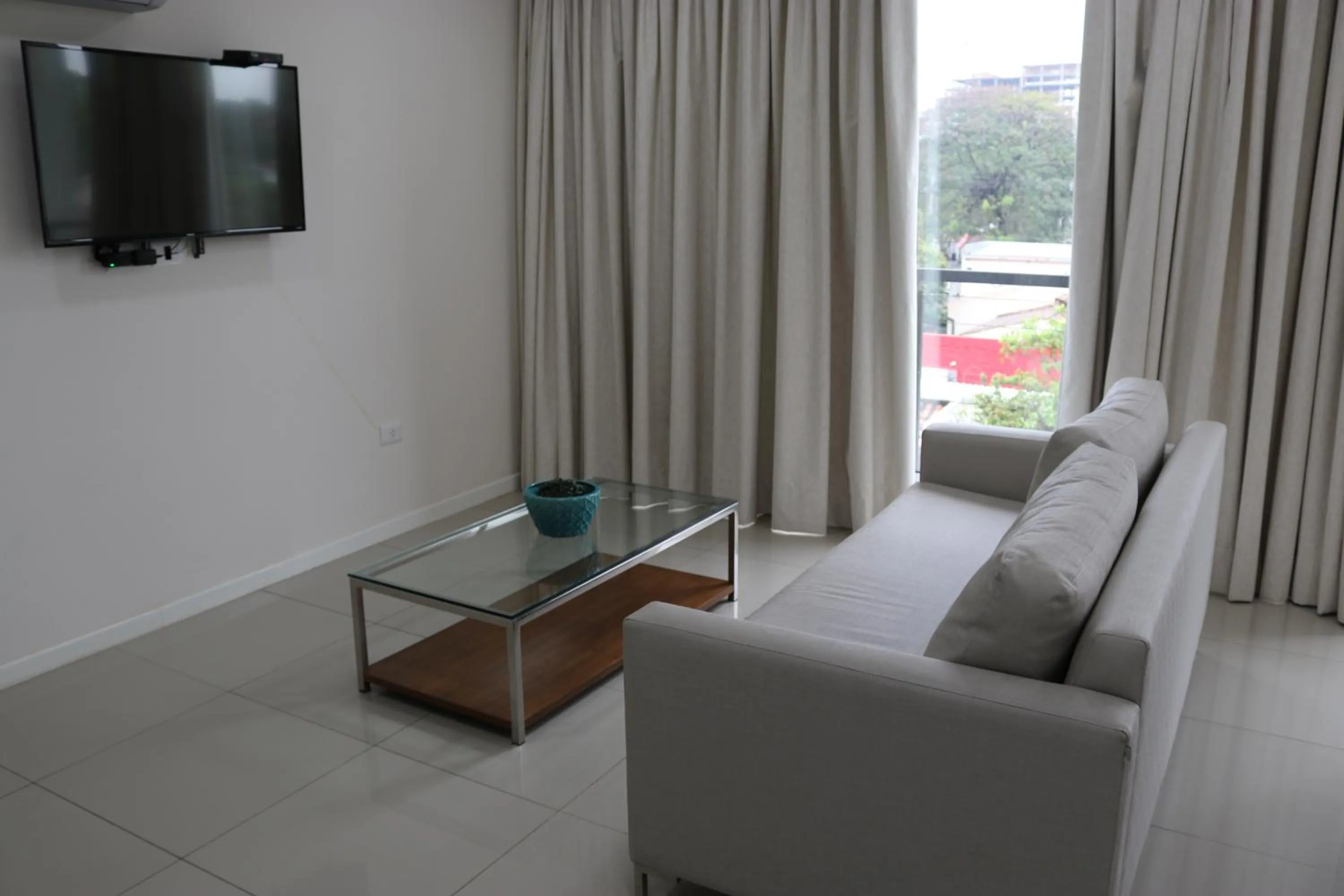 TV and multimedia in START Villa Morra Rent Apartments
