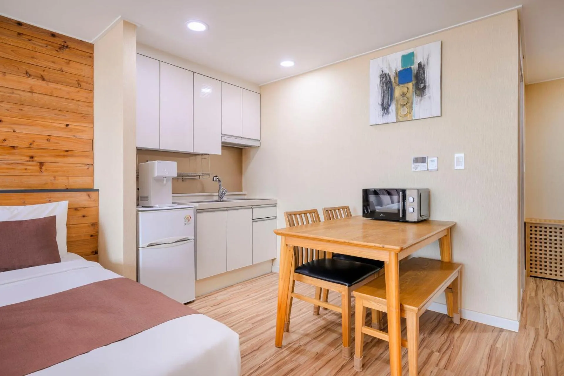 Dining area, Bed in Jeju M Resort