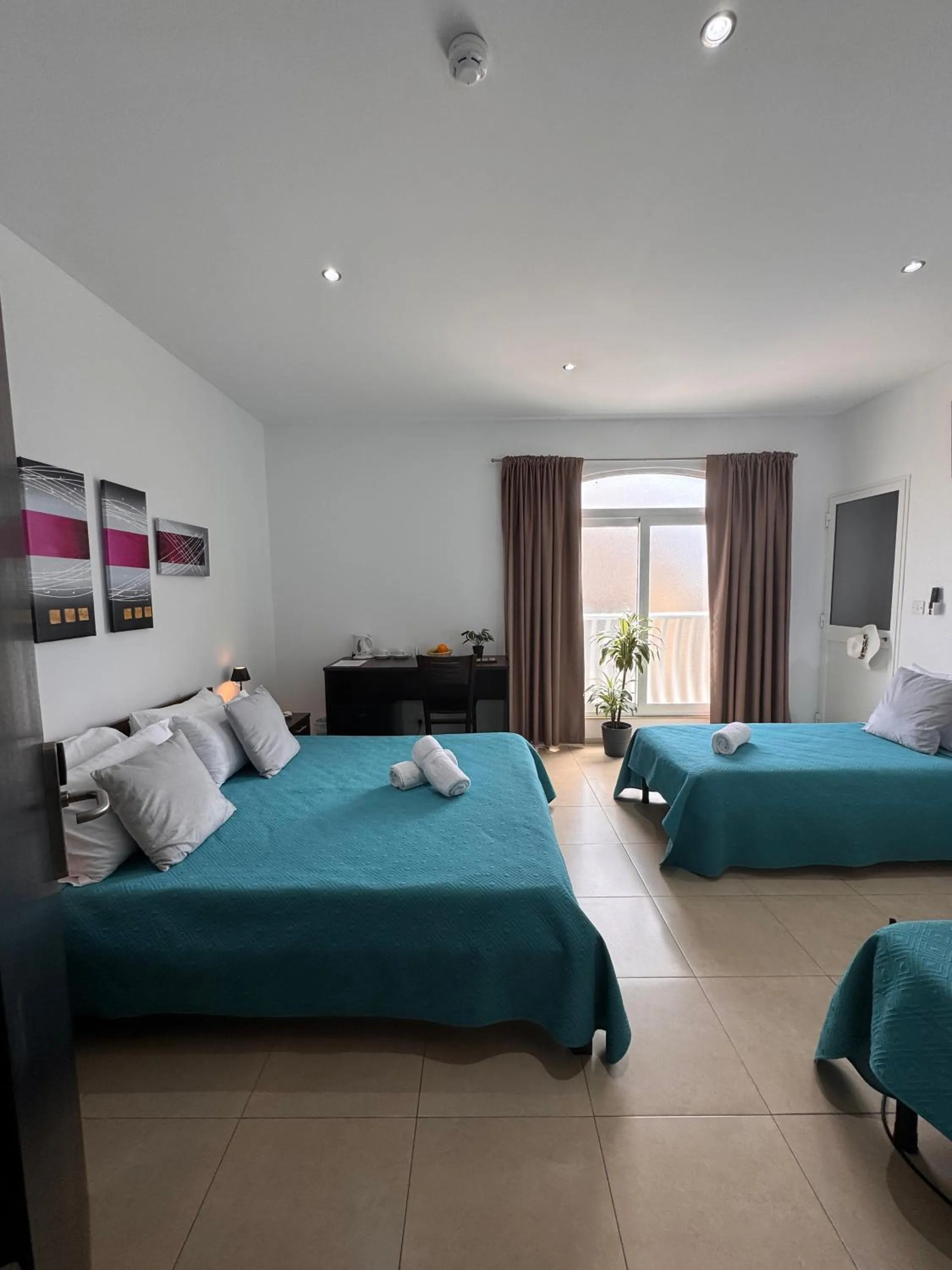 Bed in Allegro Hotel