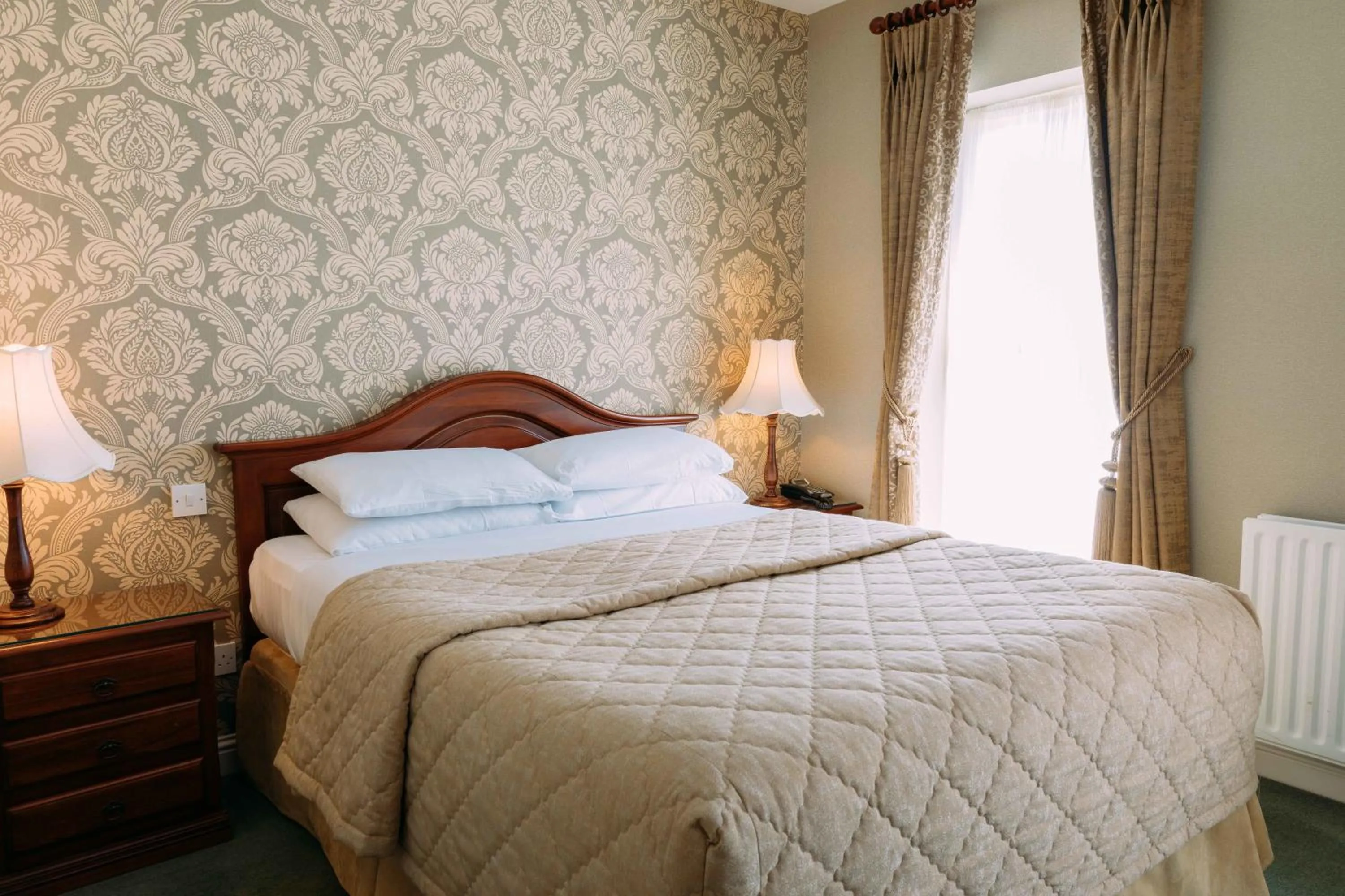 Bed in Sheedy's Boutique Hotel