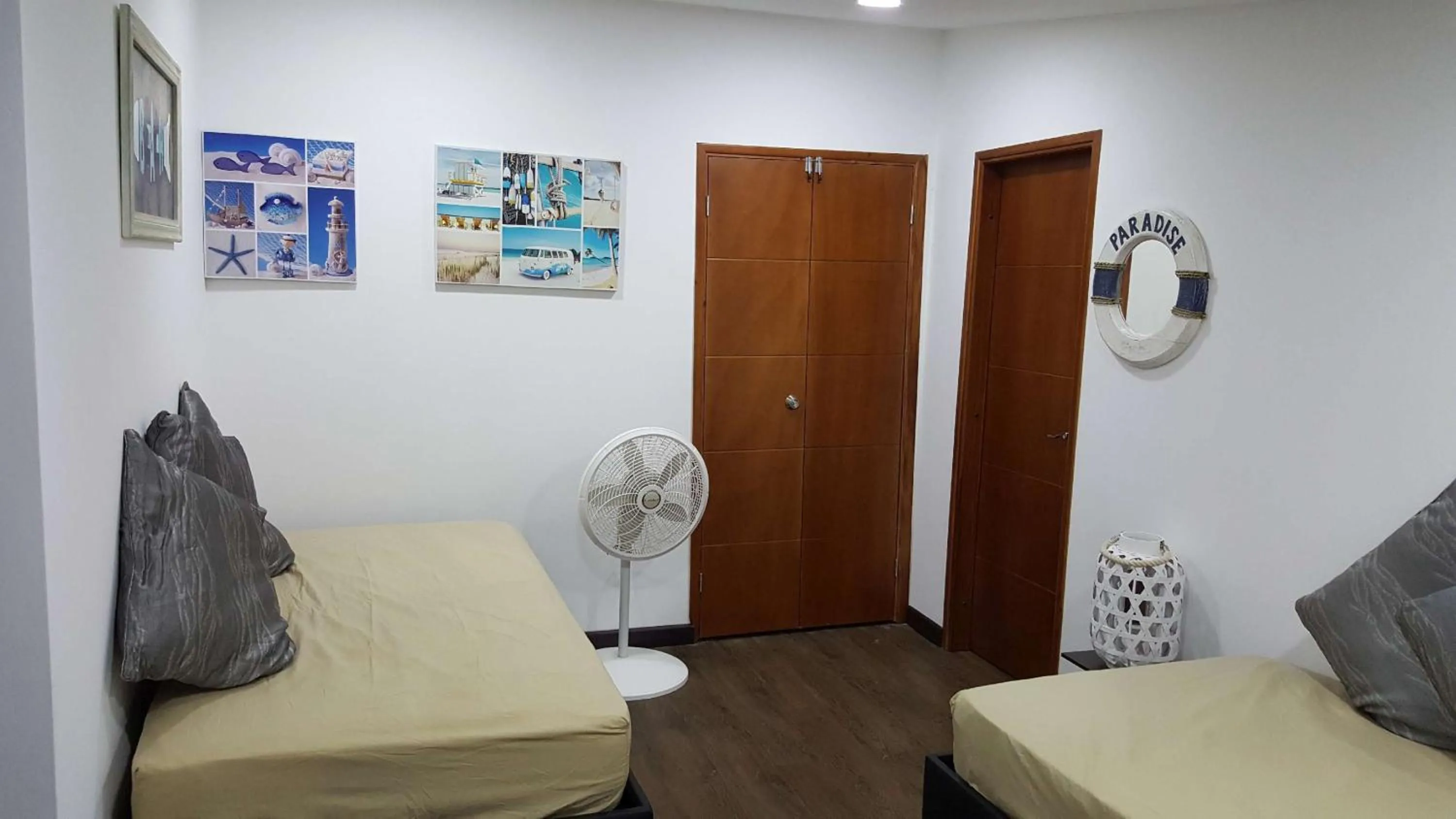 Bed in Beach Paradise Apartments