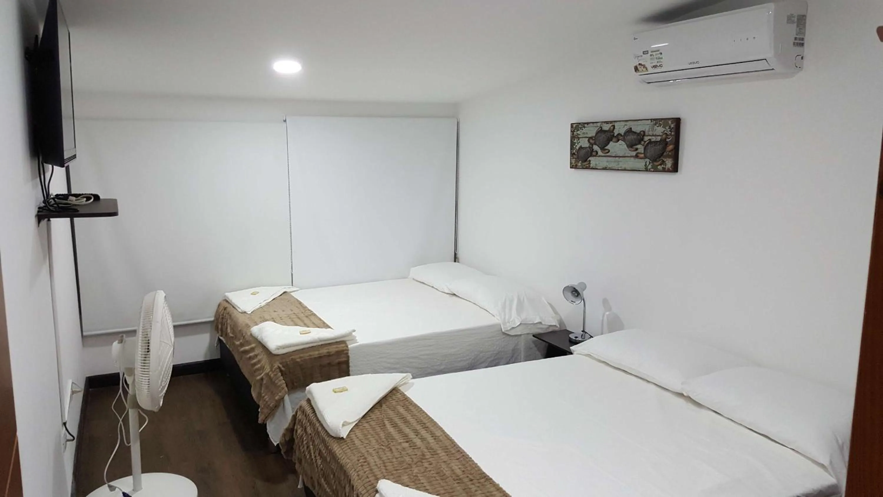 Bed in Beach Paradise Apartments