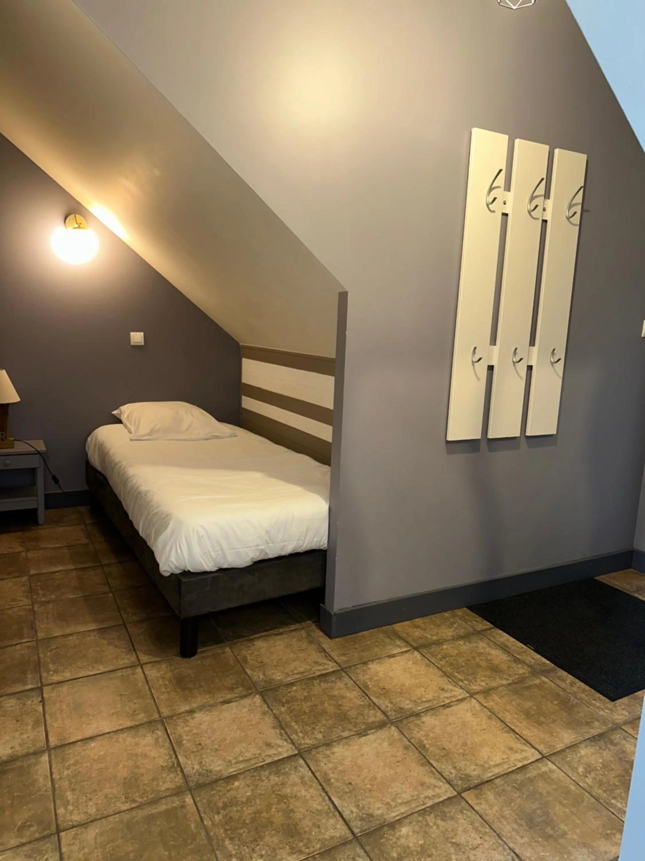 Bed in Logis Hôtel Volcan Sancy