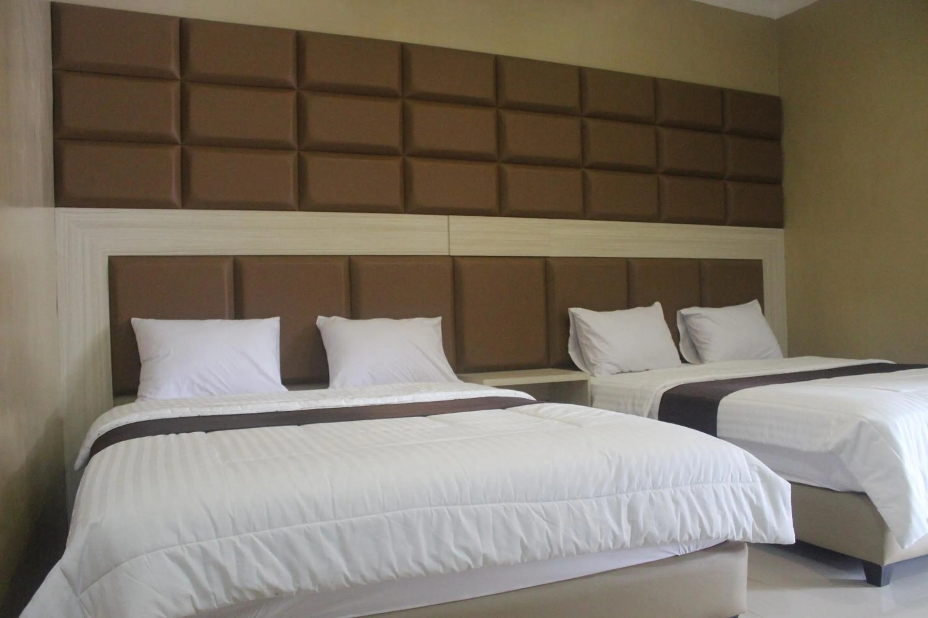Bed in Cyka Raya Hotel