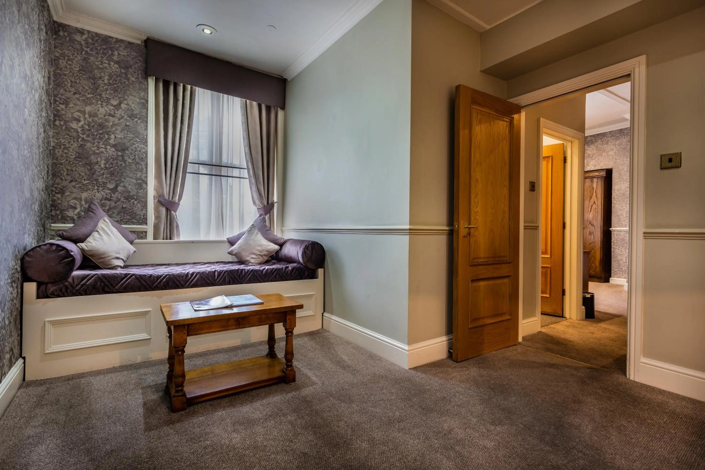 Living room, Bed in The Swan Hotel, Stafford, Staffordshire - The Coaching Inn Group