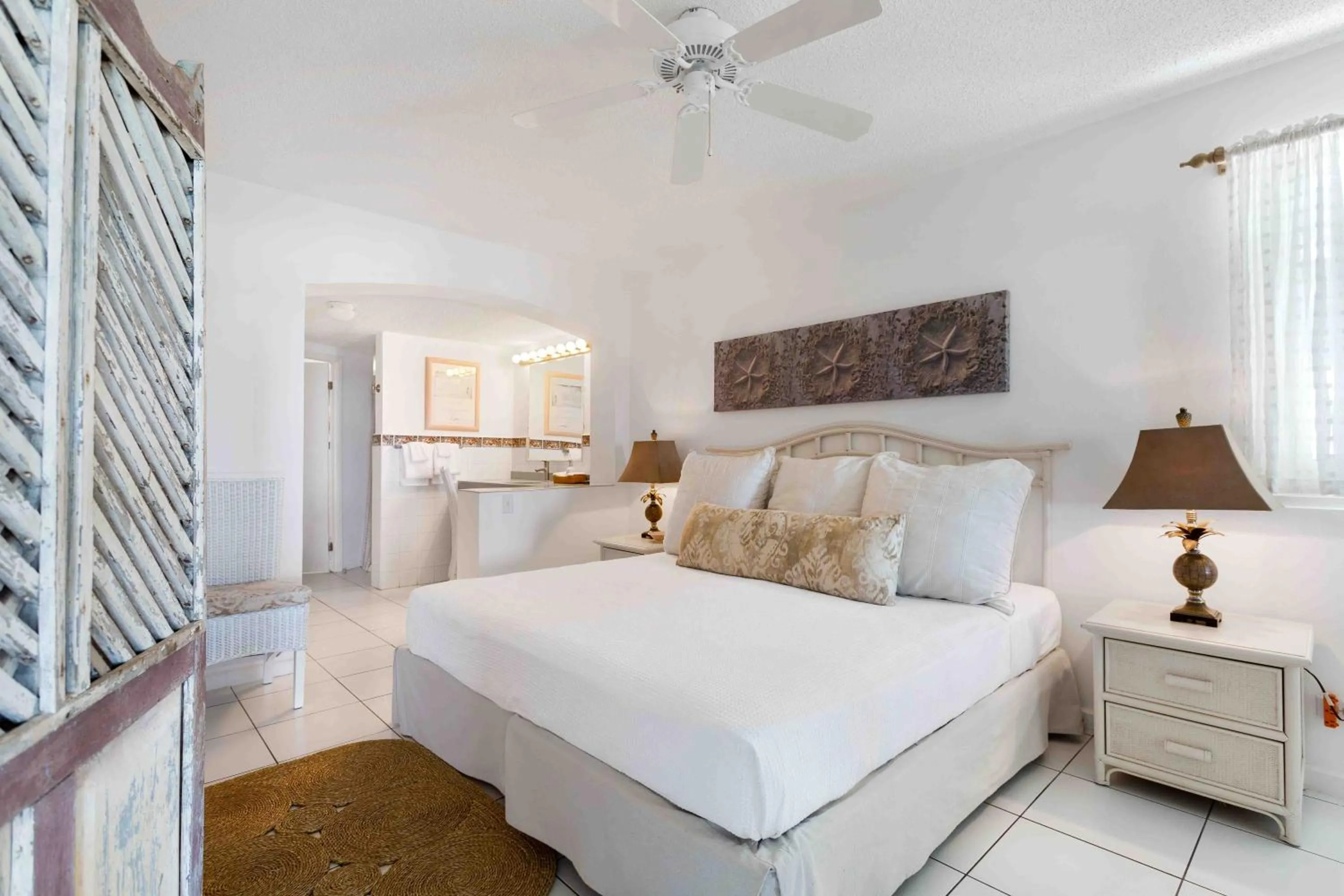 Bed in Turtle's Nest Beach Resort