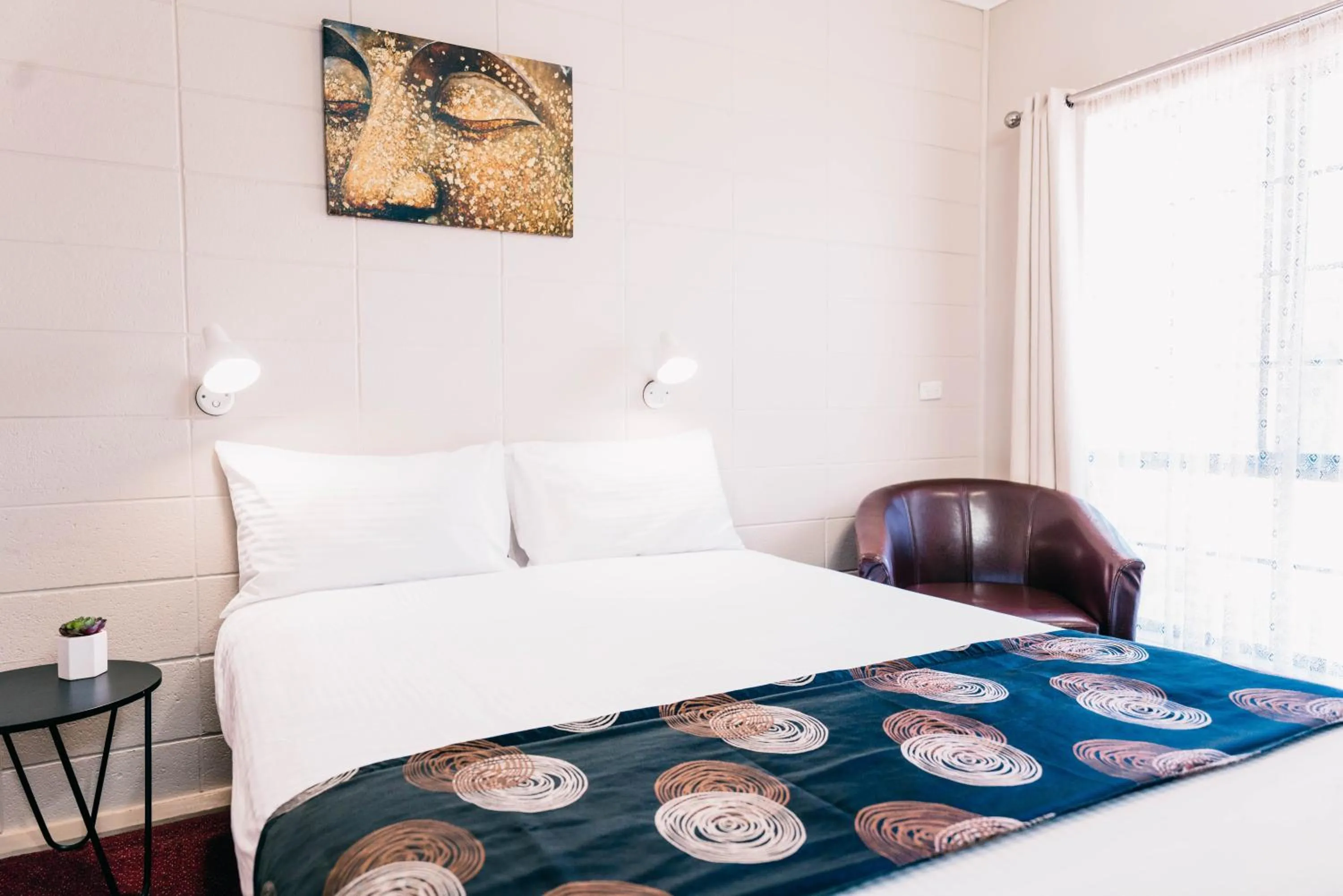 Bed in Motel Poinsettia