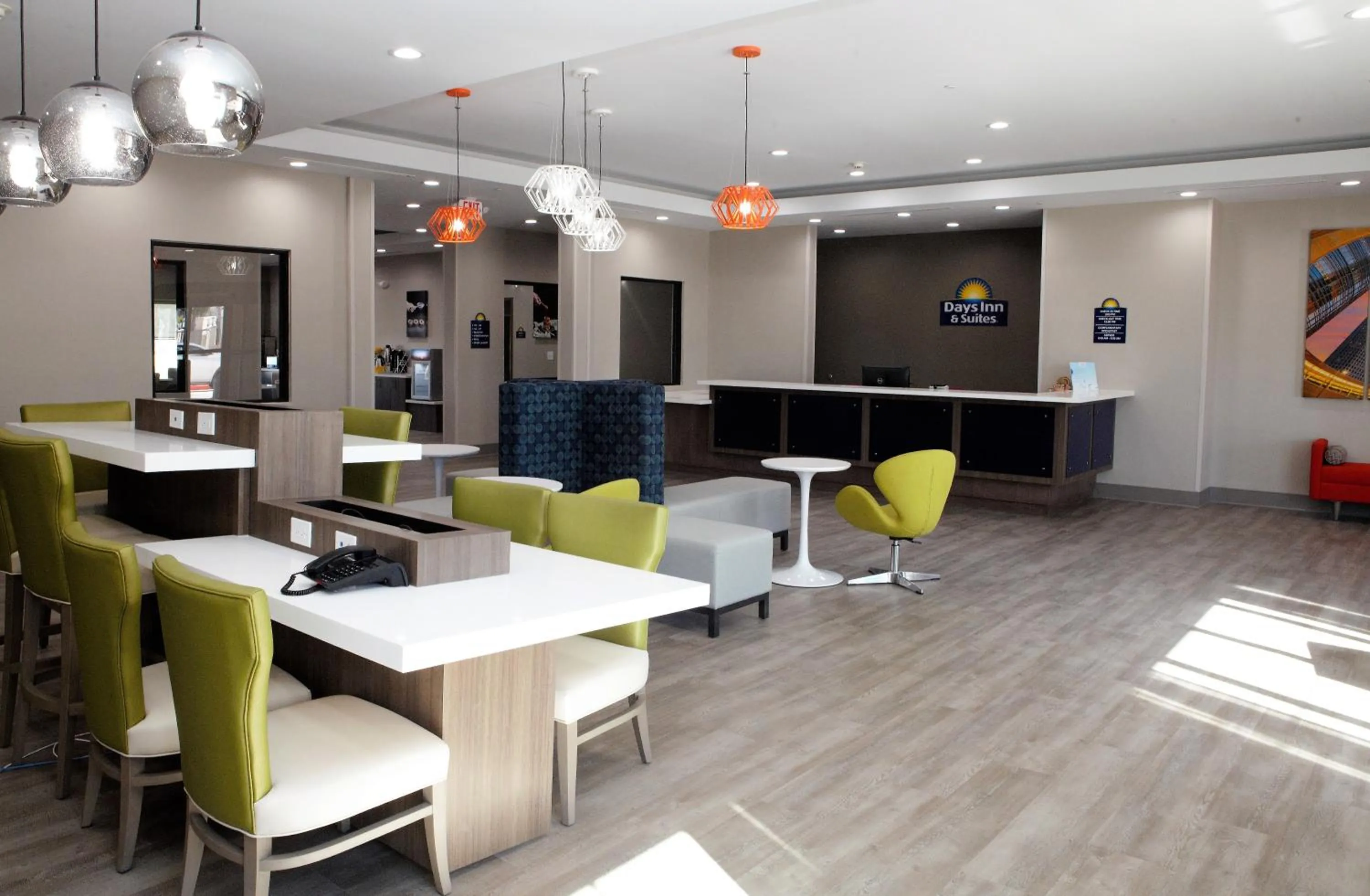 Communal lounge/ TV room in Days Inn & Suites by Wyndham Houston NW Cypress