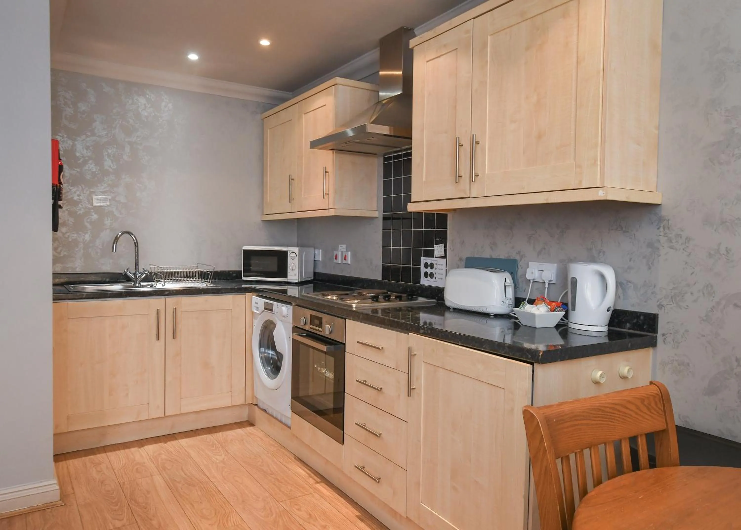 Kitchen or kitchenette in The Queens Hotel & Victoria Cloisters Apartments